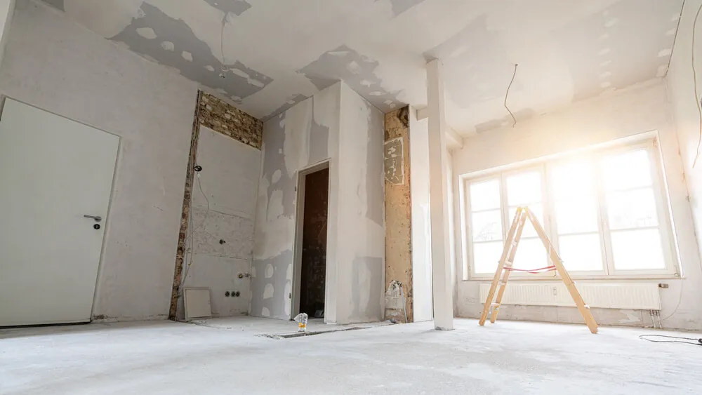 Team performing a residential cleanout service, removing debris and unwanted items from a home after renovation.