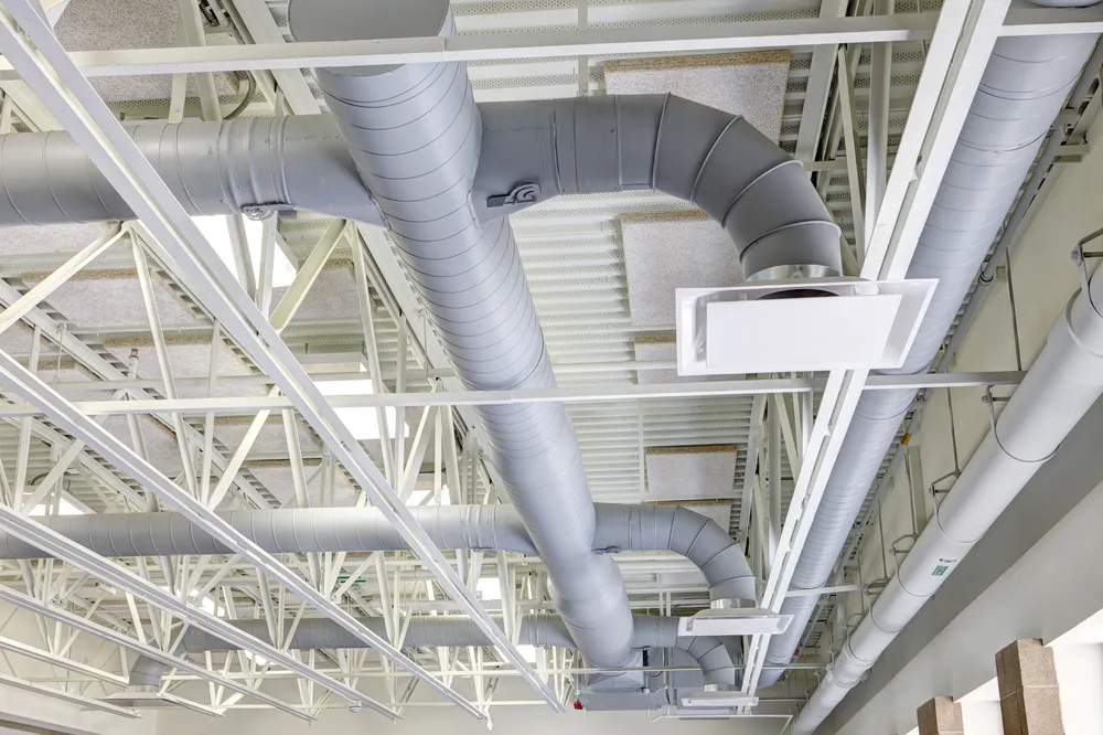 A photograph of ductwork above. Ductwork services are an example of routine maintenance to help ensure air conditioning units are performing optimally.