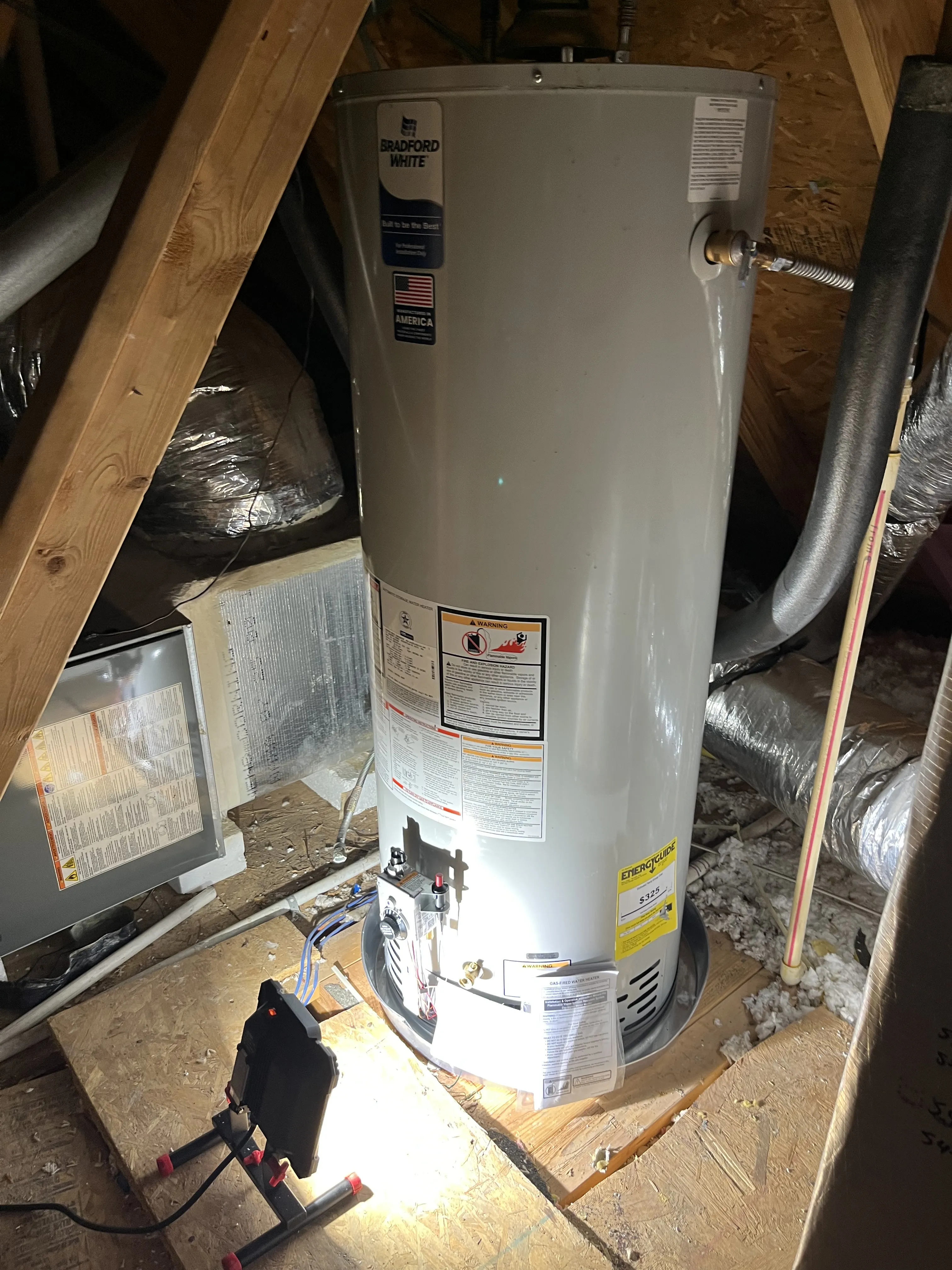 A master plumber completing a professional water heater installation for an Austin homeowner.