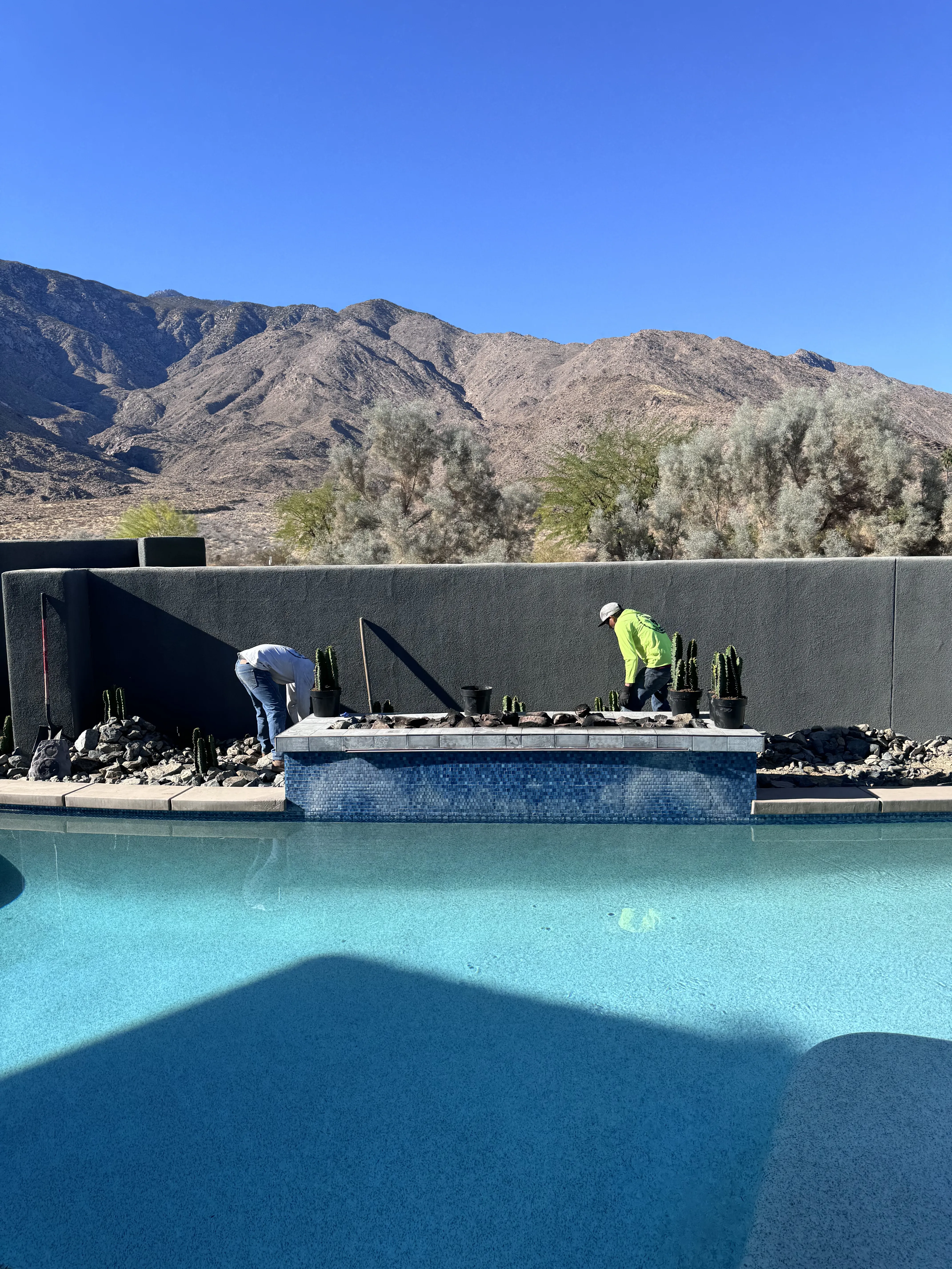 The dedicated team of Oro Desert Spartan Landscaping at work in a Palm Springs landscape project, showcasing their commitment to creating desert paradises.