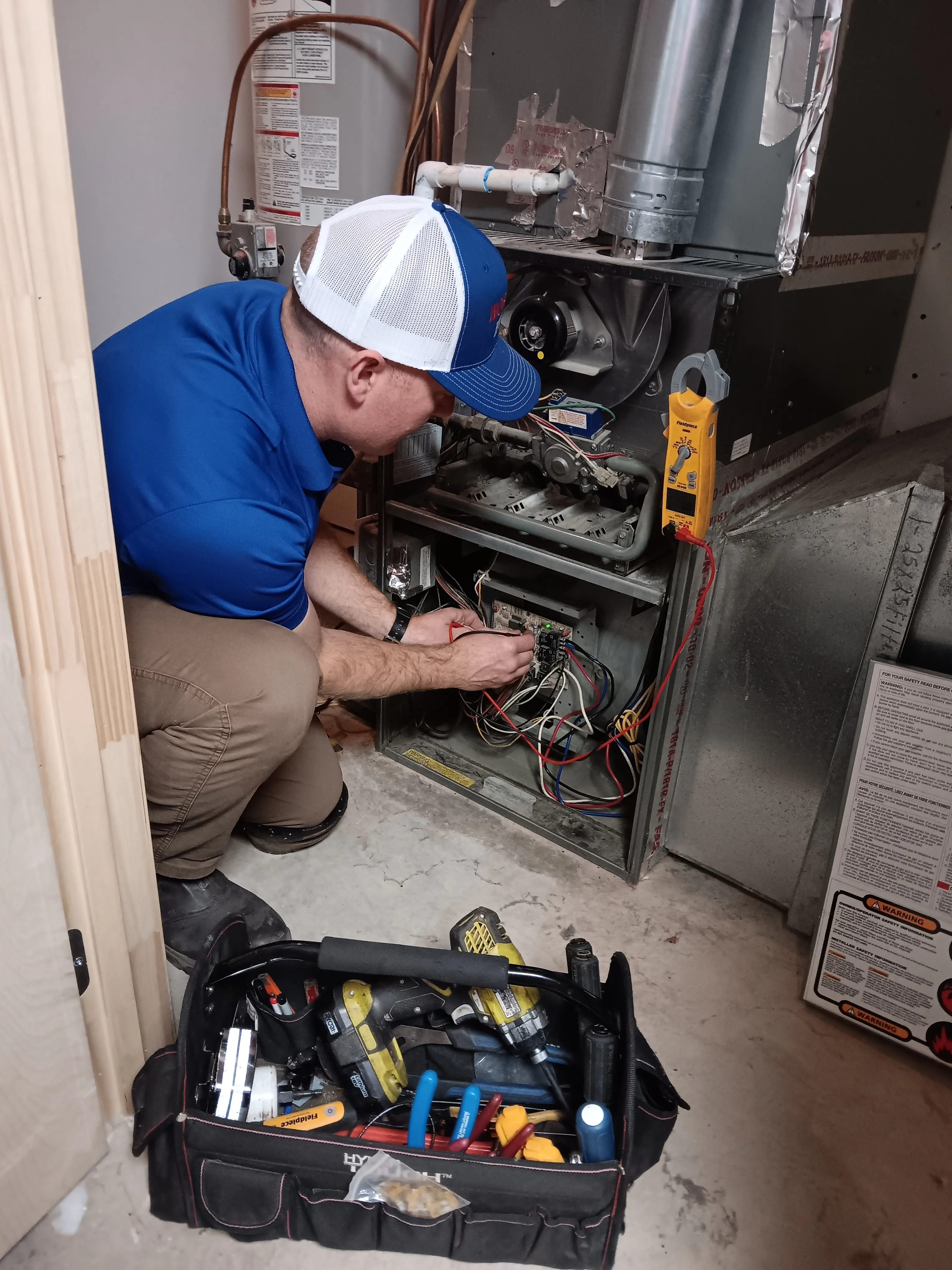 NATE-certified technician performing precise air conditioning and heat repair in Kimberly, AL