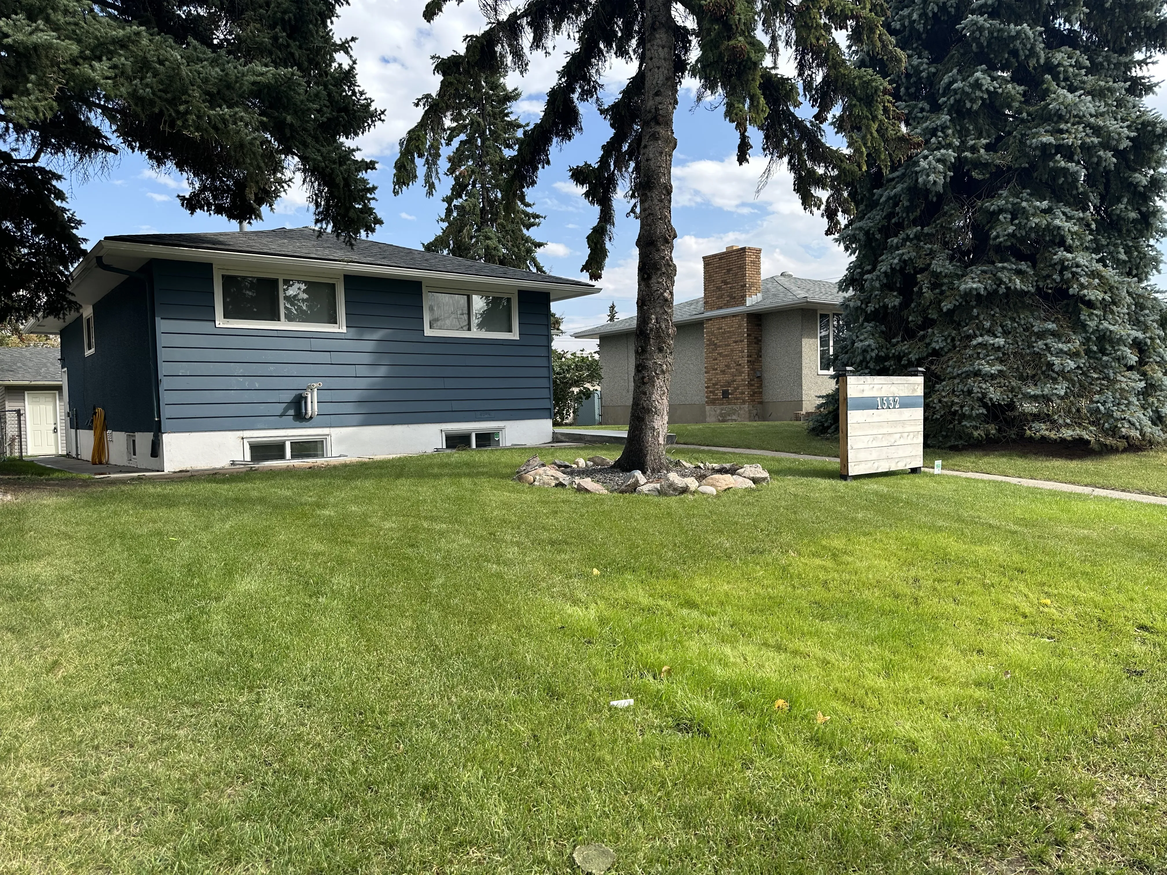 A mowed lawn for lawn care services and all your landscaping needs in Calgary, AB.