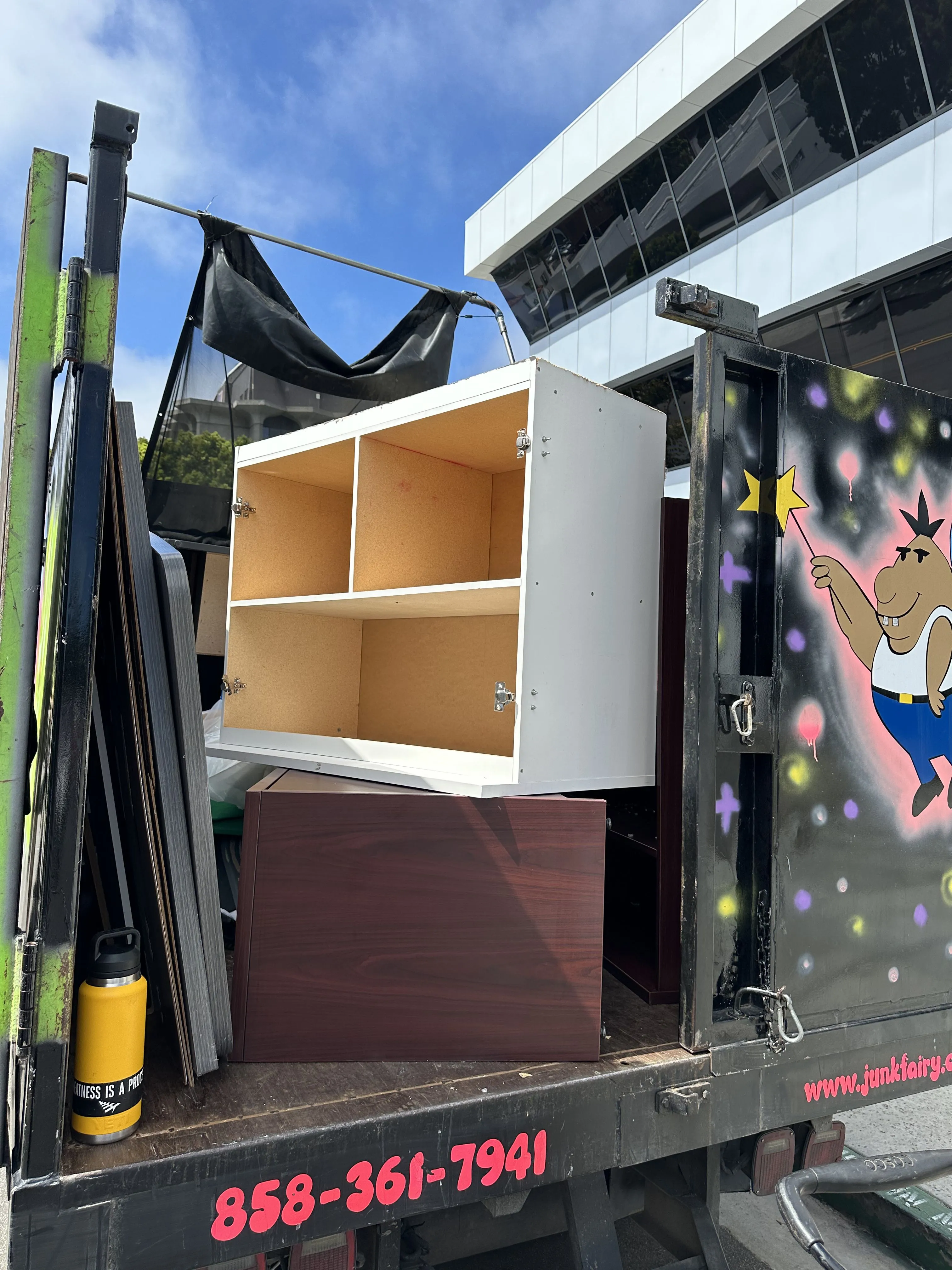 Junk Fairy truck carrying furniture junk.