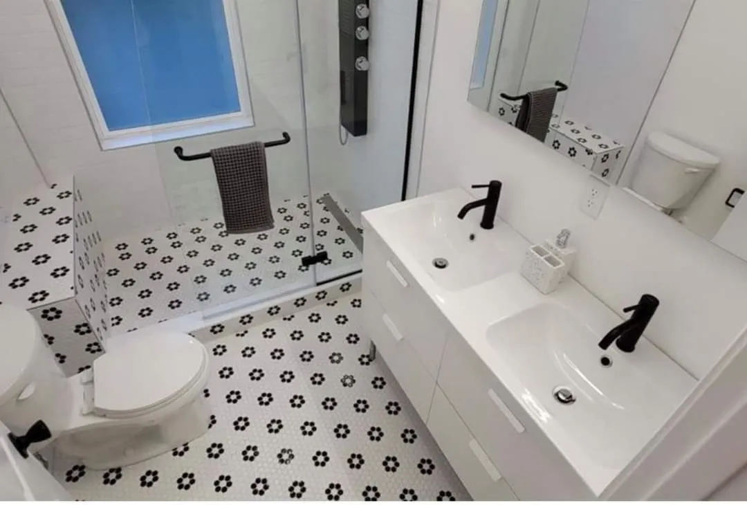 Elegant and spacious bathroom with black plumbing fixtures remodeling project designed in Cincinnati, Hamilton County service area. 