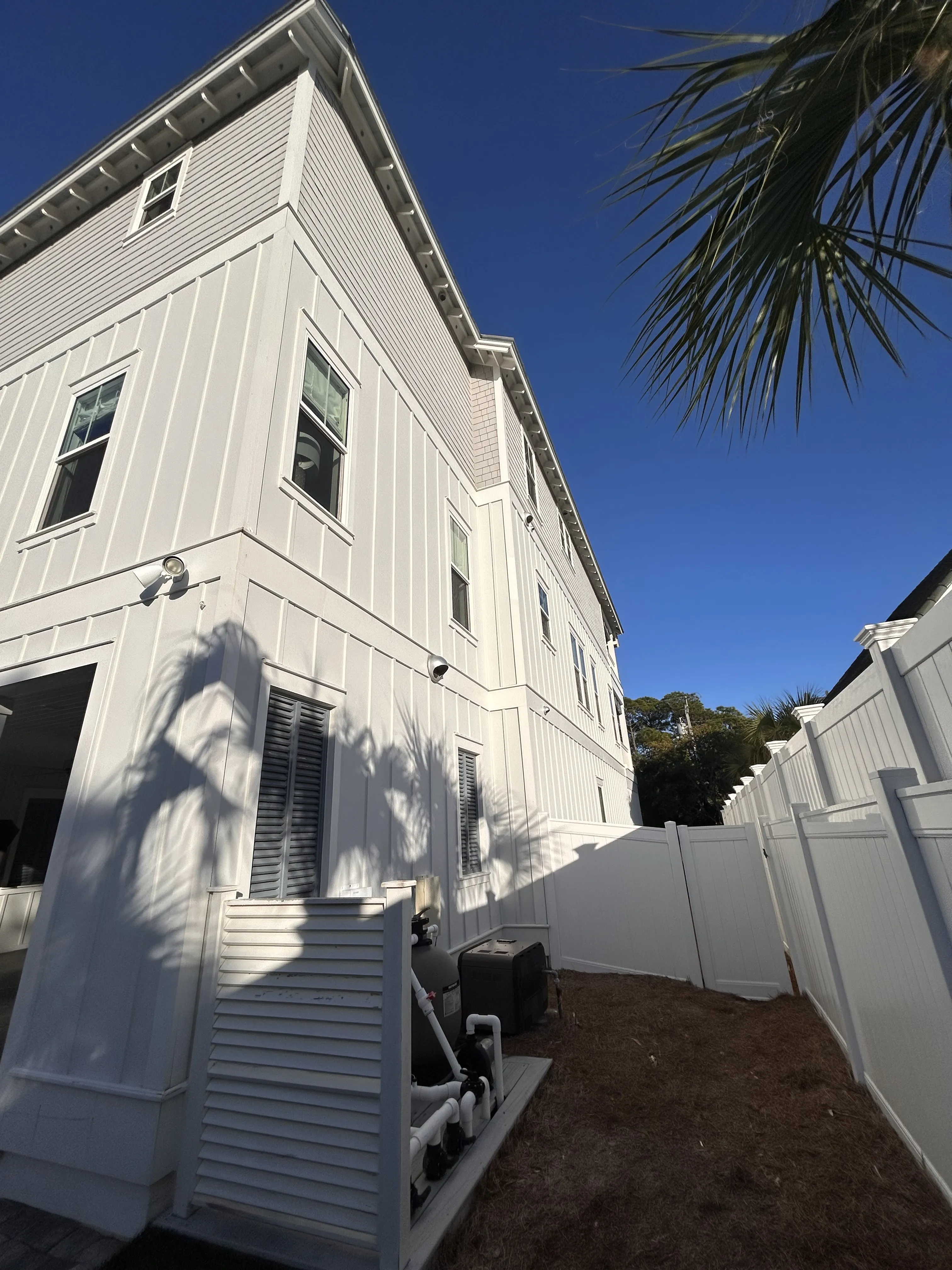 Hydro Max 360 technician expertly pressure washing a property in Santa Rosa Beach.