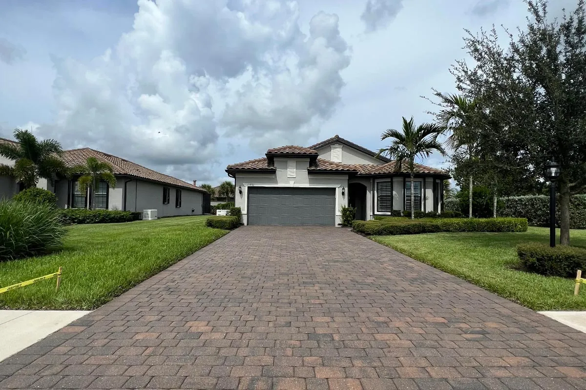 A driveway sealed by Local Paver Sealing and Soft Washing in Estero, FL.