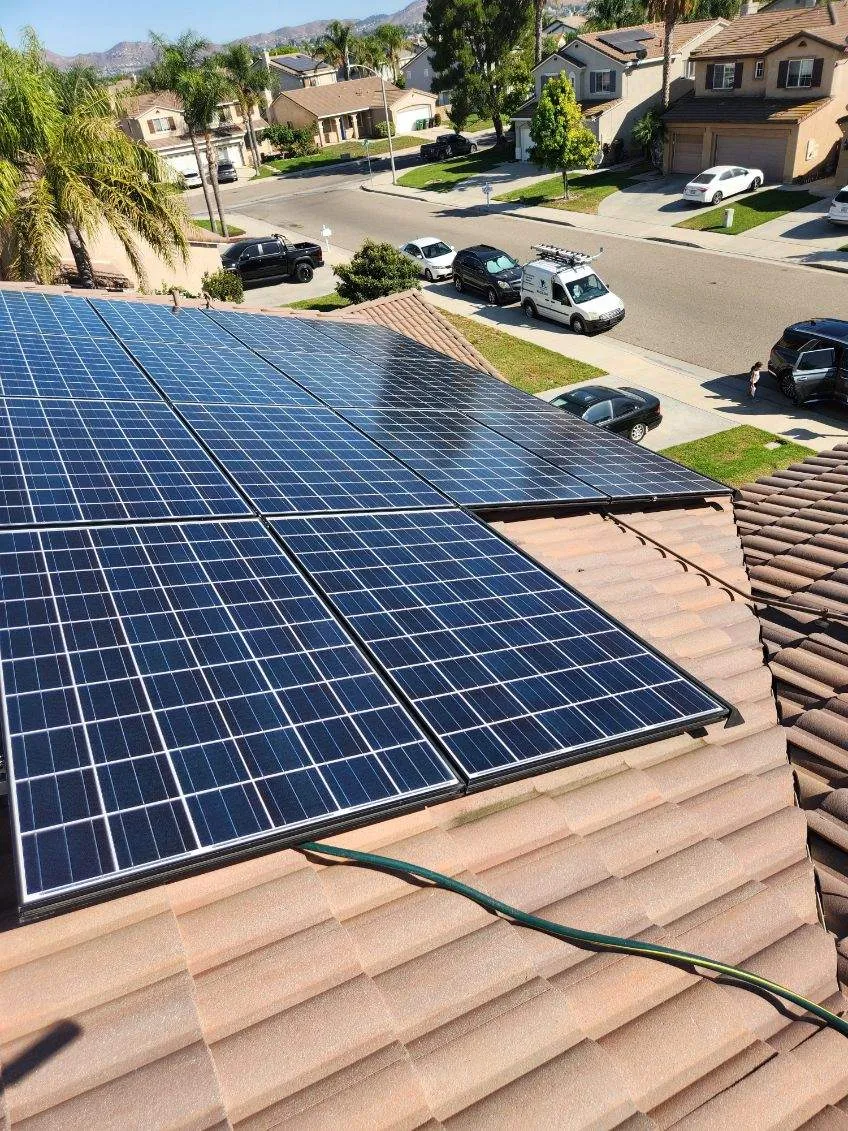 Solar panels on a roof that reflect sunlight, ideal for keeping outside windows streak free and remove dirt and other debris from the panels effectively.