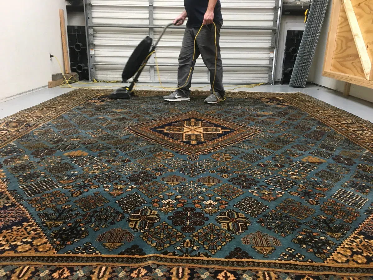 Professional area rug cleaning in process by Clear Water Carpet Cleaning.