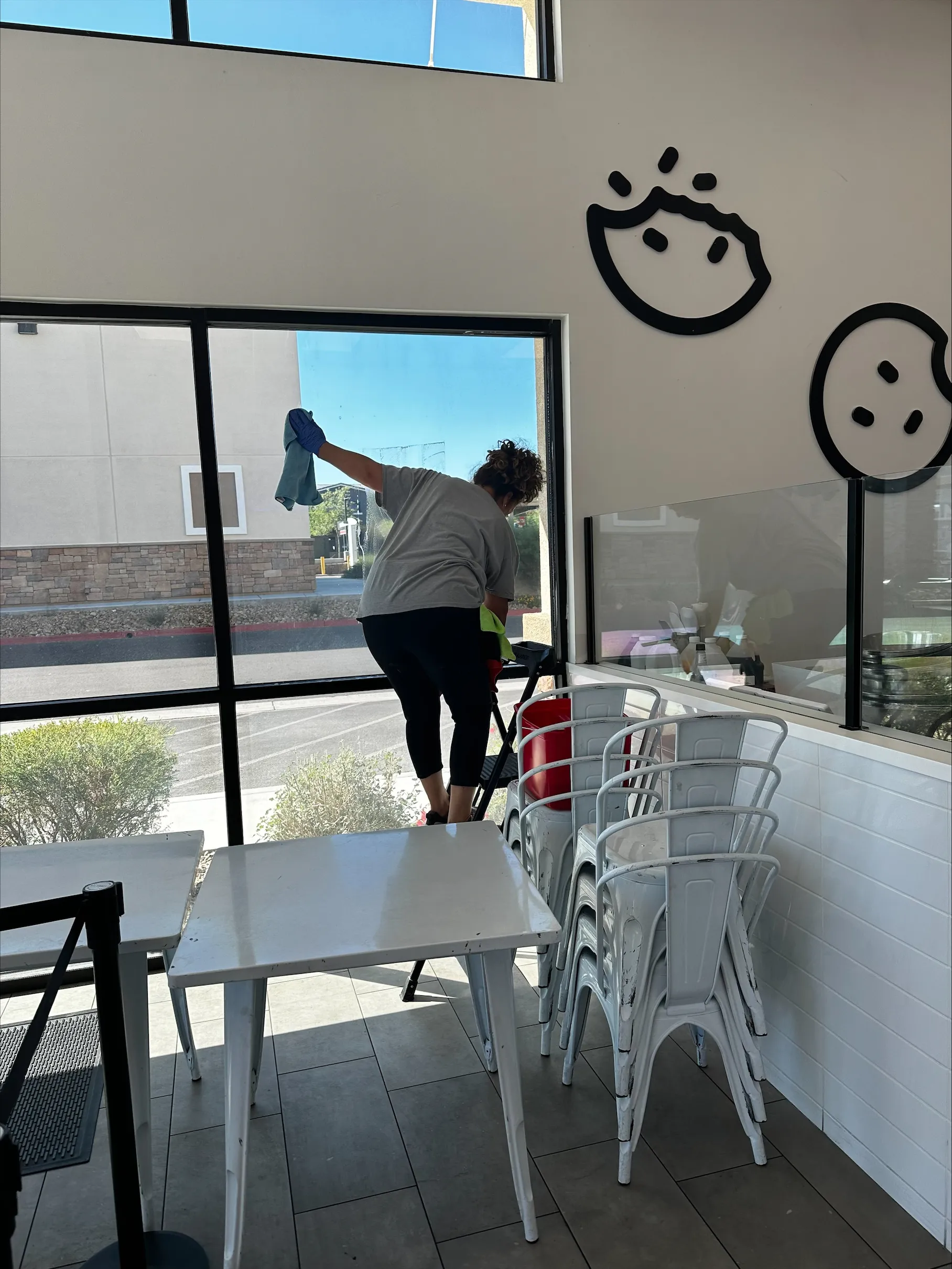 CitiClean Services cleaning technician cleaning the interior windows of a commercial space in Las Vegas.