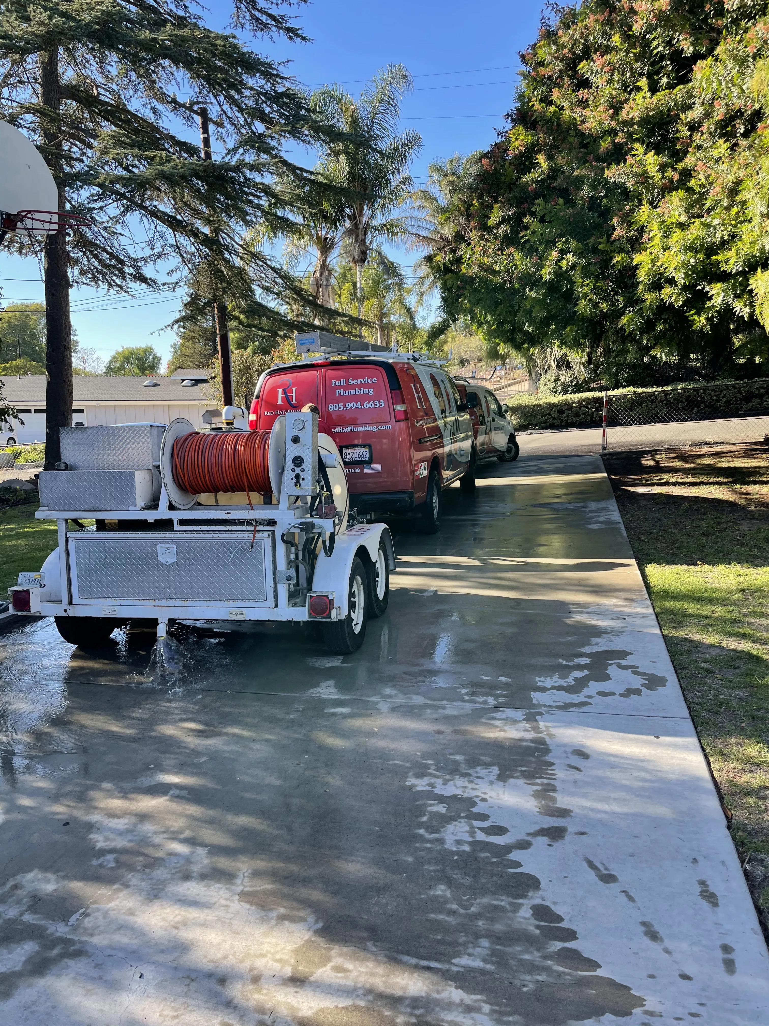 Red Hat Plumbing performing hydro jetting.