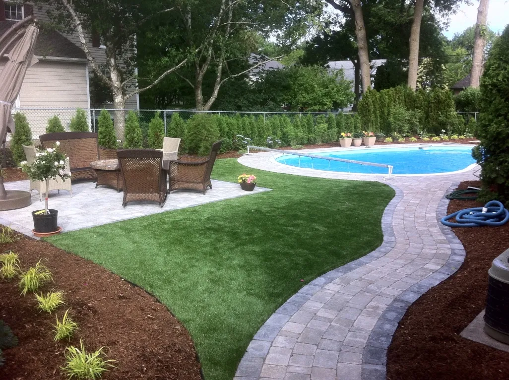 Elegant residential lawn meticulously maintained by Lawn Guys Co. in Kingston, Ontario.