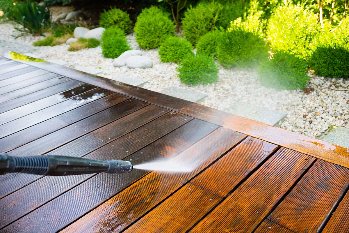 Professional deck washing is in progress.