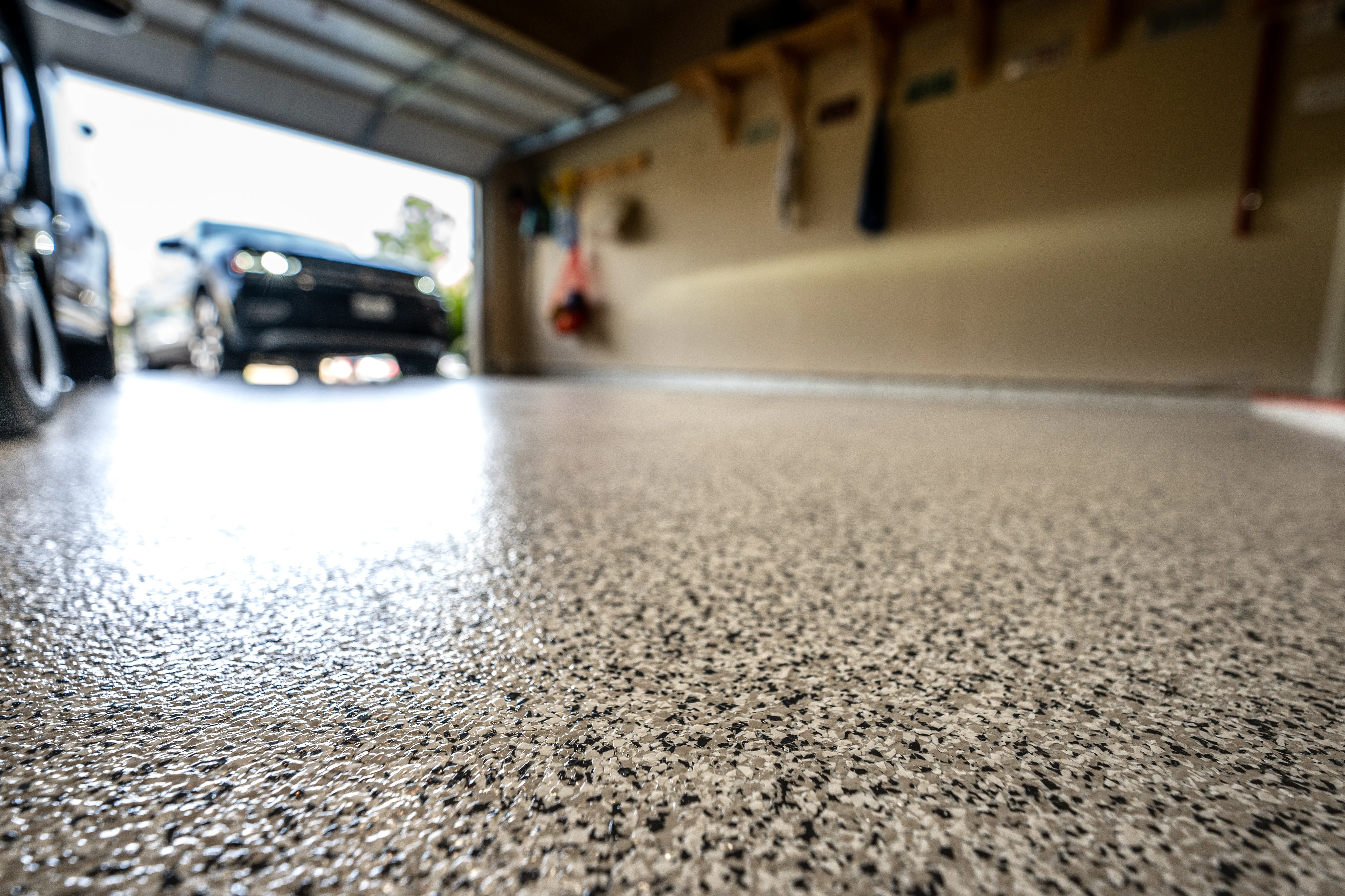 Skilled professional doing epoxy flooring in a Los Angeles home