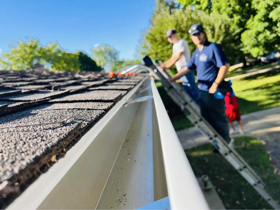 Clean gutters installation on a roof shingles property to avoid costly repairs in Metro Detroit, MI.