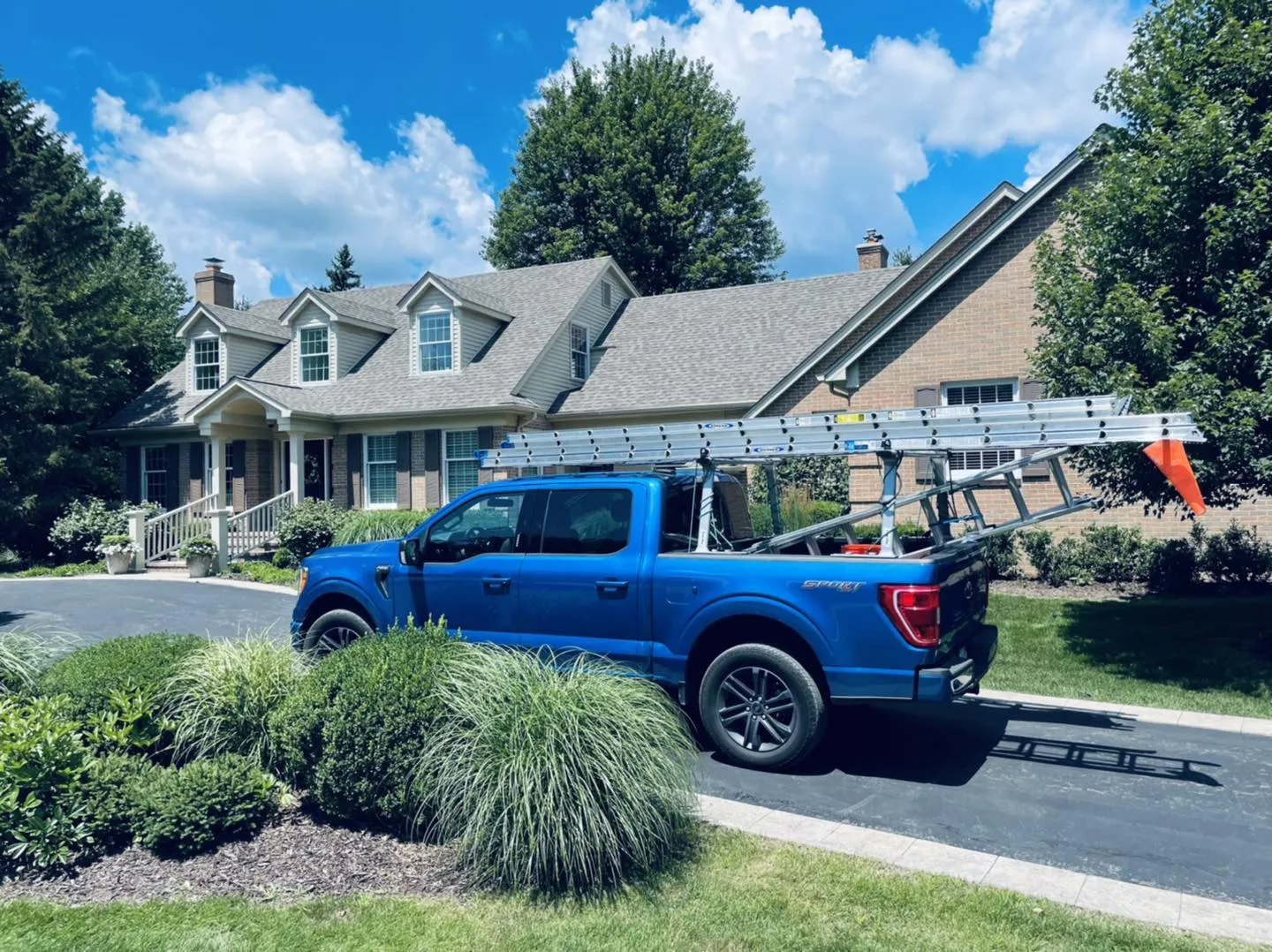 Quality work on a two-story house—professional gutter cleaning services for proper water flow in the Detroit area.