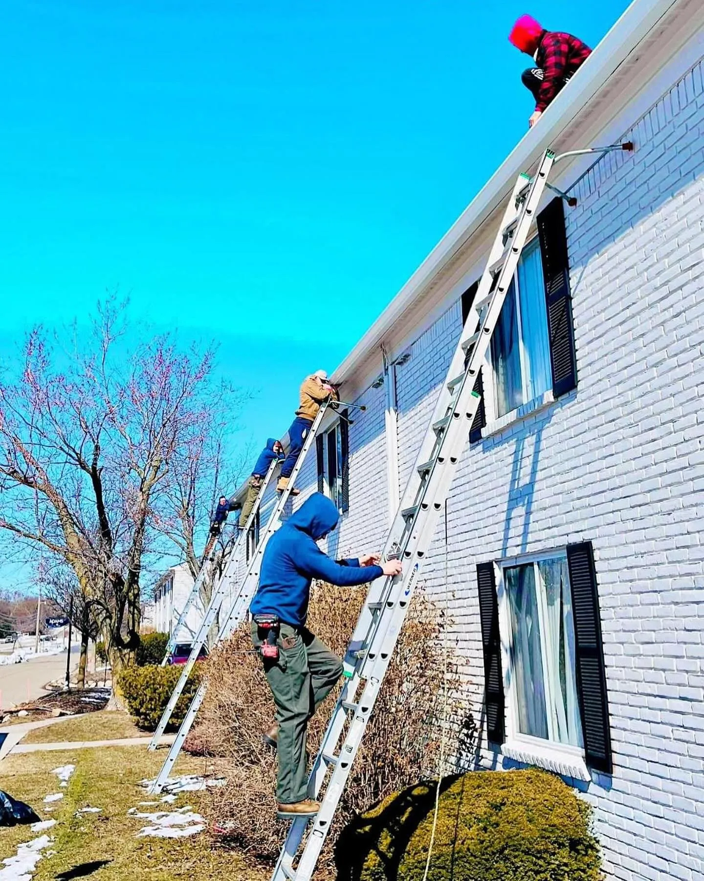 A dedicated team from Midwest Gutter Cleaning performs thorough cleaning on clogged gutters in Livonia, Michigan