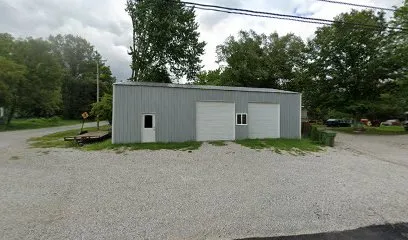 Well-lit garage space with tools and equipment available for rental.