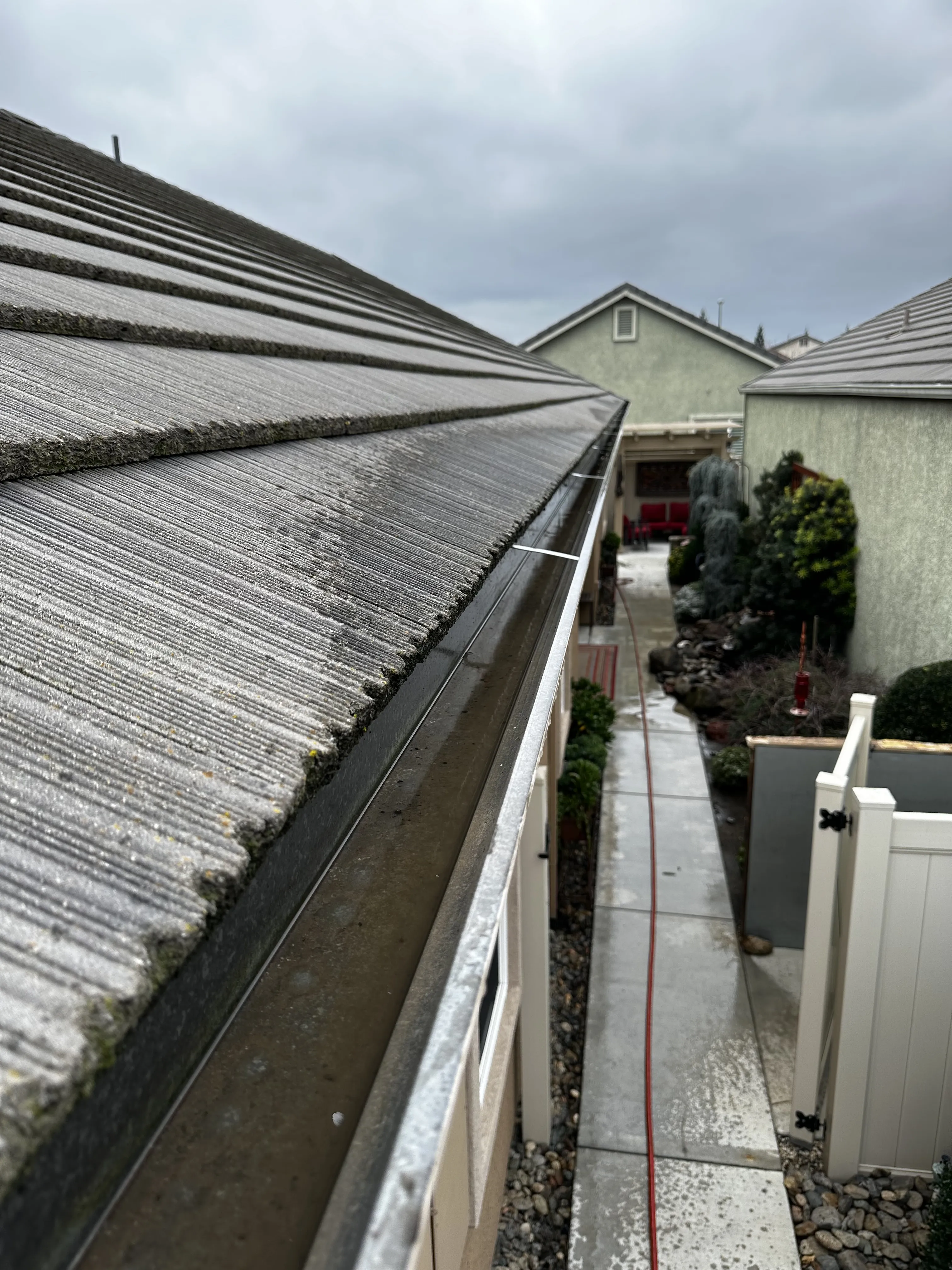 The result of our gutter cleaning services in Modesto, CA.