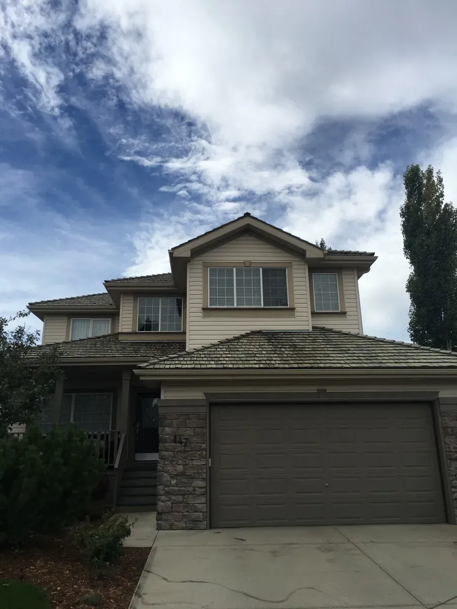 Pressure washing services for a house in Calgary, AB.