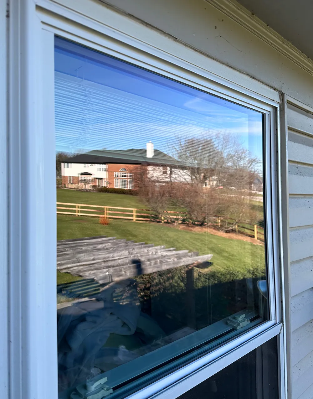 A spotless, transparent window in Loveland after Infiniti Glass's expert cleaning service.