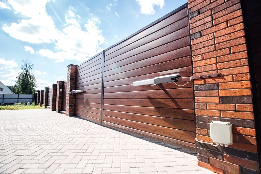 Fence-It Co. specialists installing an advanced automated gate system in Walla Walla, WA.