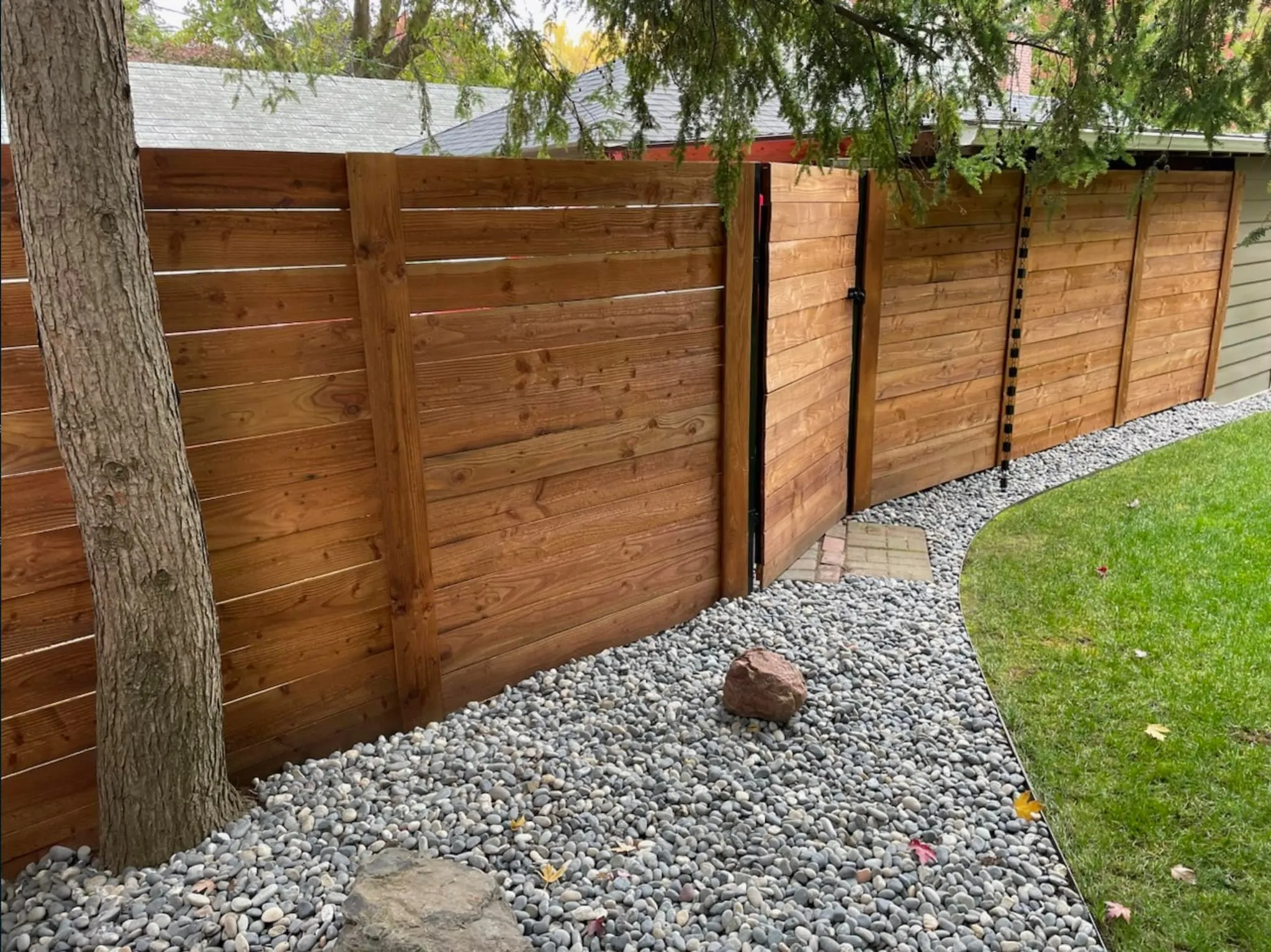 Dedicated fence company installing a new fence with the highest quality materials after a free quote.