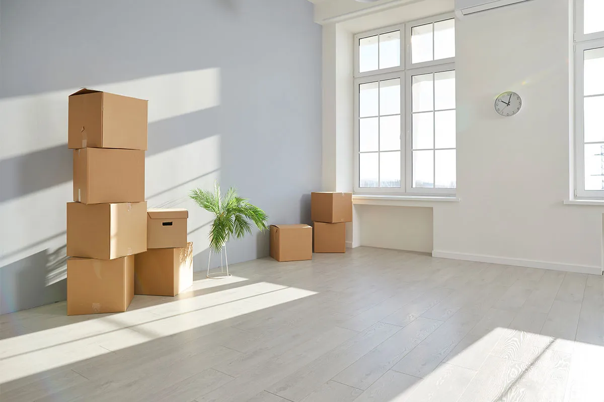 Move-out boxes packed in clean apartment after move-out cleaning.