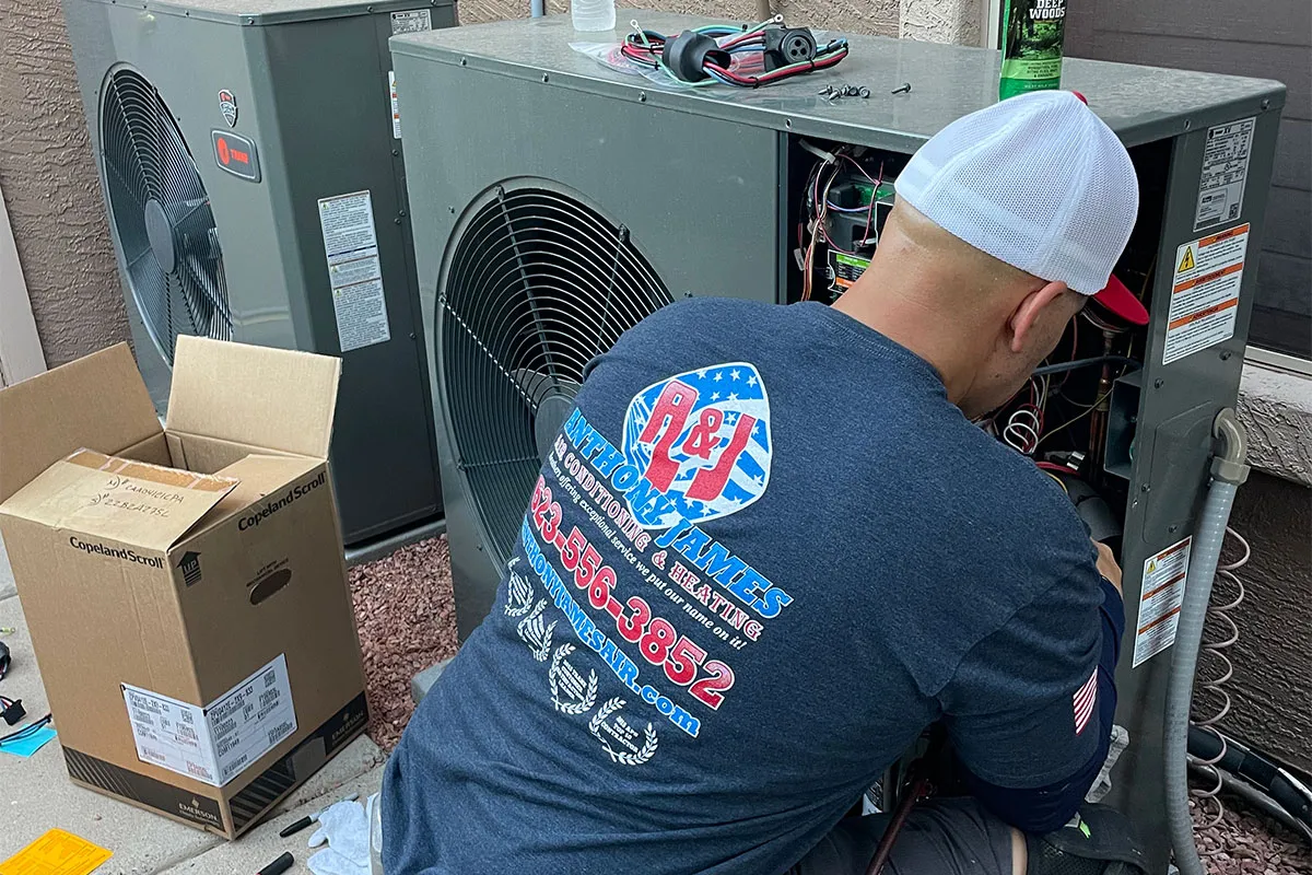 Professional maintaining the HVAC System in Arizona.