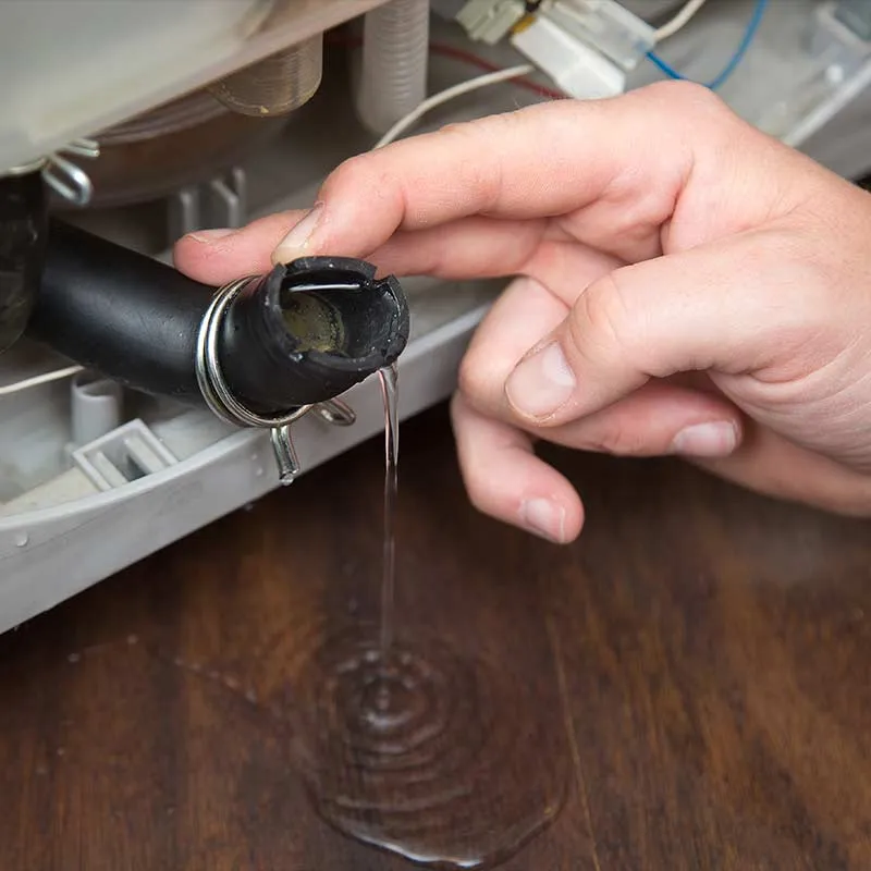 Expert technician repairing a washing machine in Kansas City, Missouri