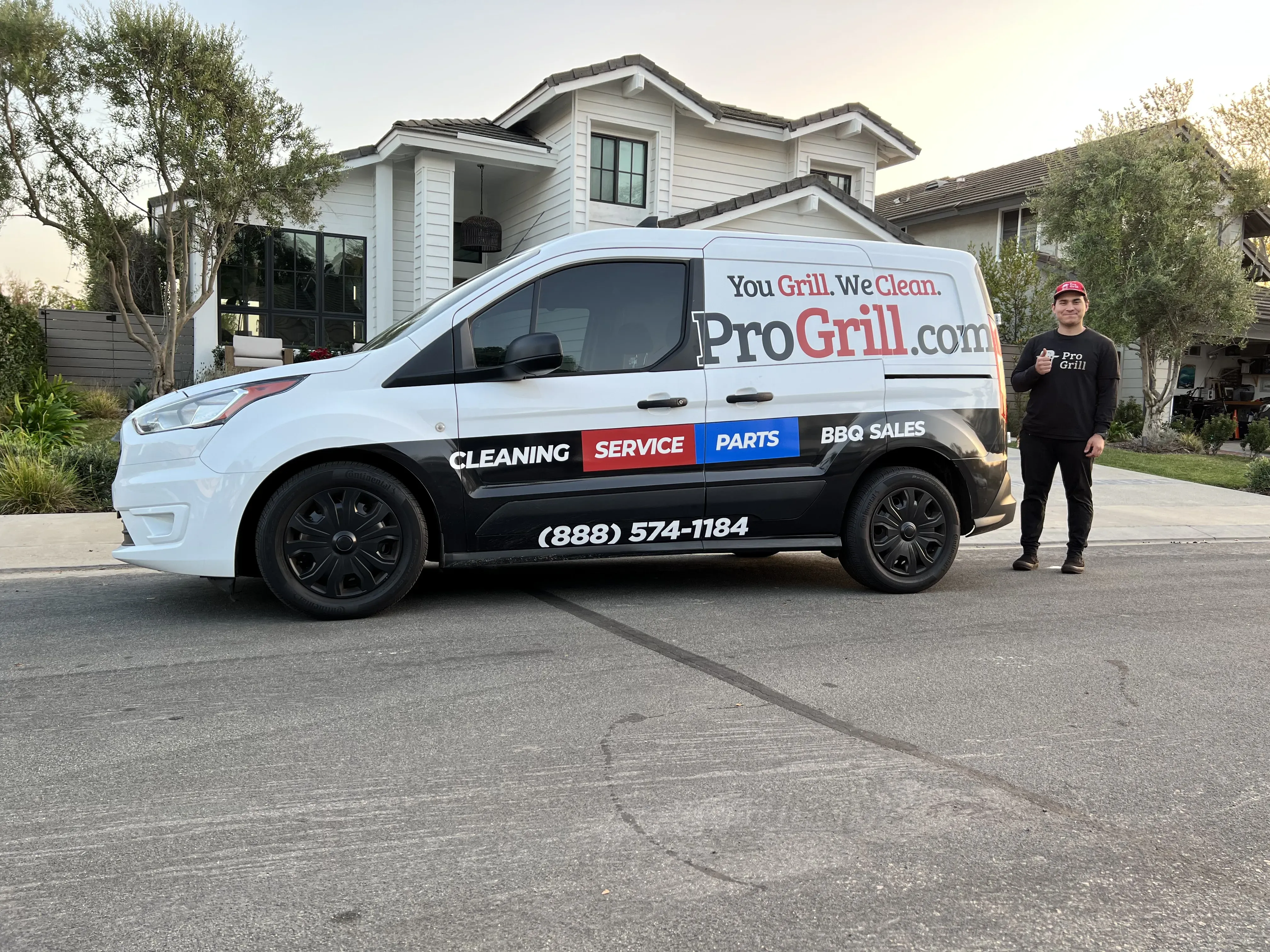 Pro Grill team member next to their van at a home in Orange County.