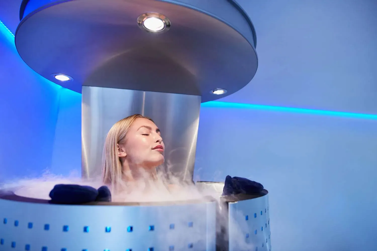 A patient inside a cryotherapy machine, an innovative physical therapy tool.