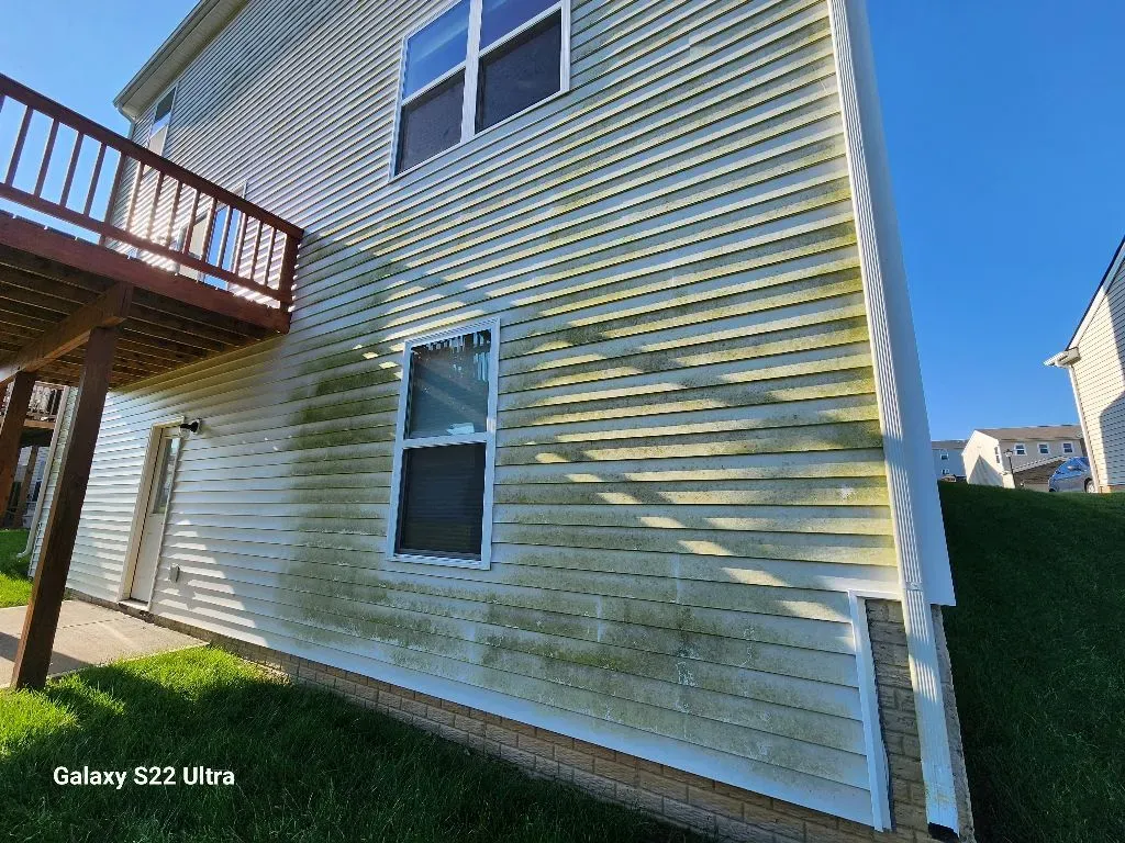 before washing the house on a sunny day with clear blue skies