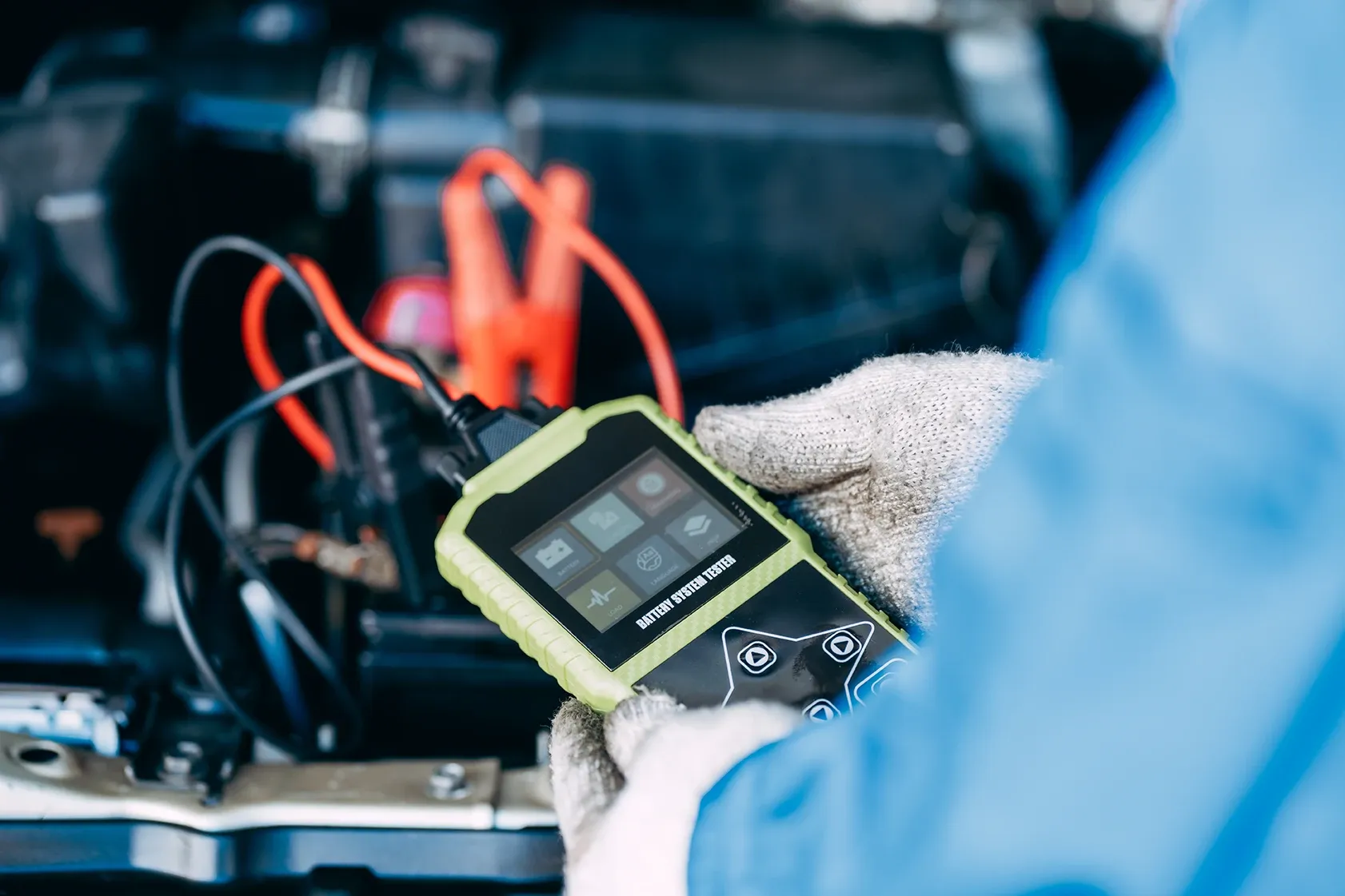 A mobile technician performing a tune-up on a car engine in New Caney, TX.
