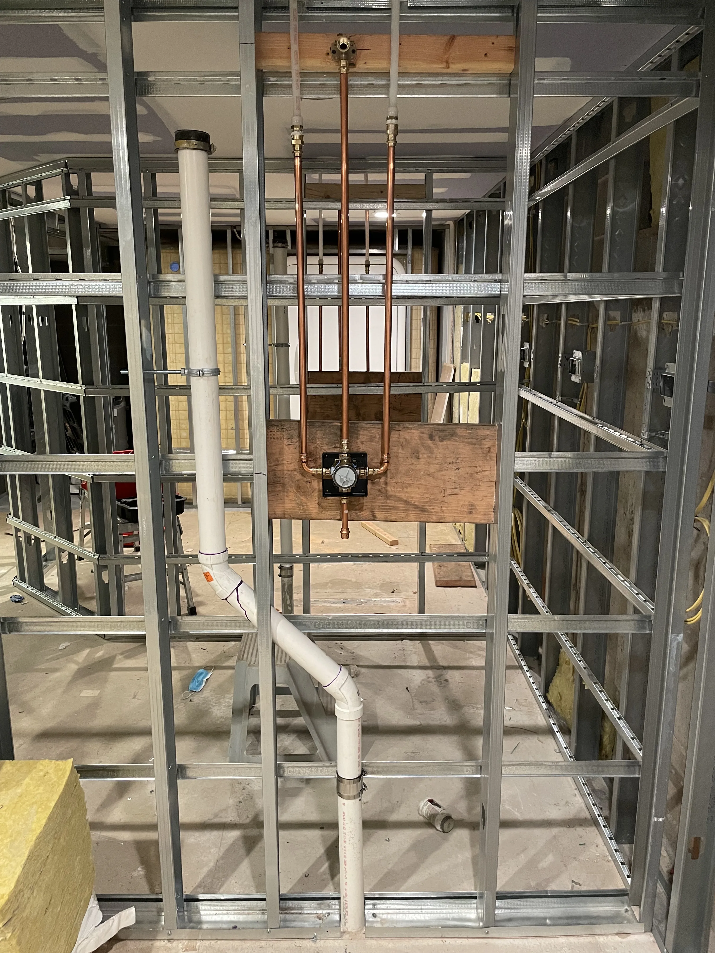Licensed plumber installing water pipes in Coventry, CT.