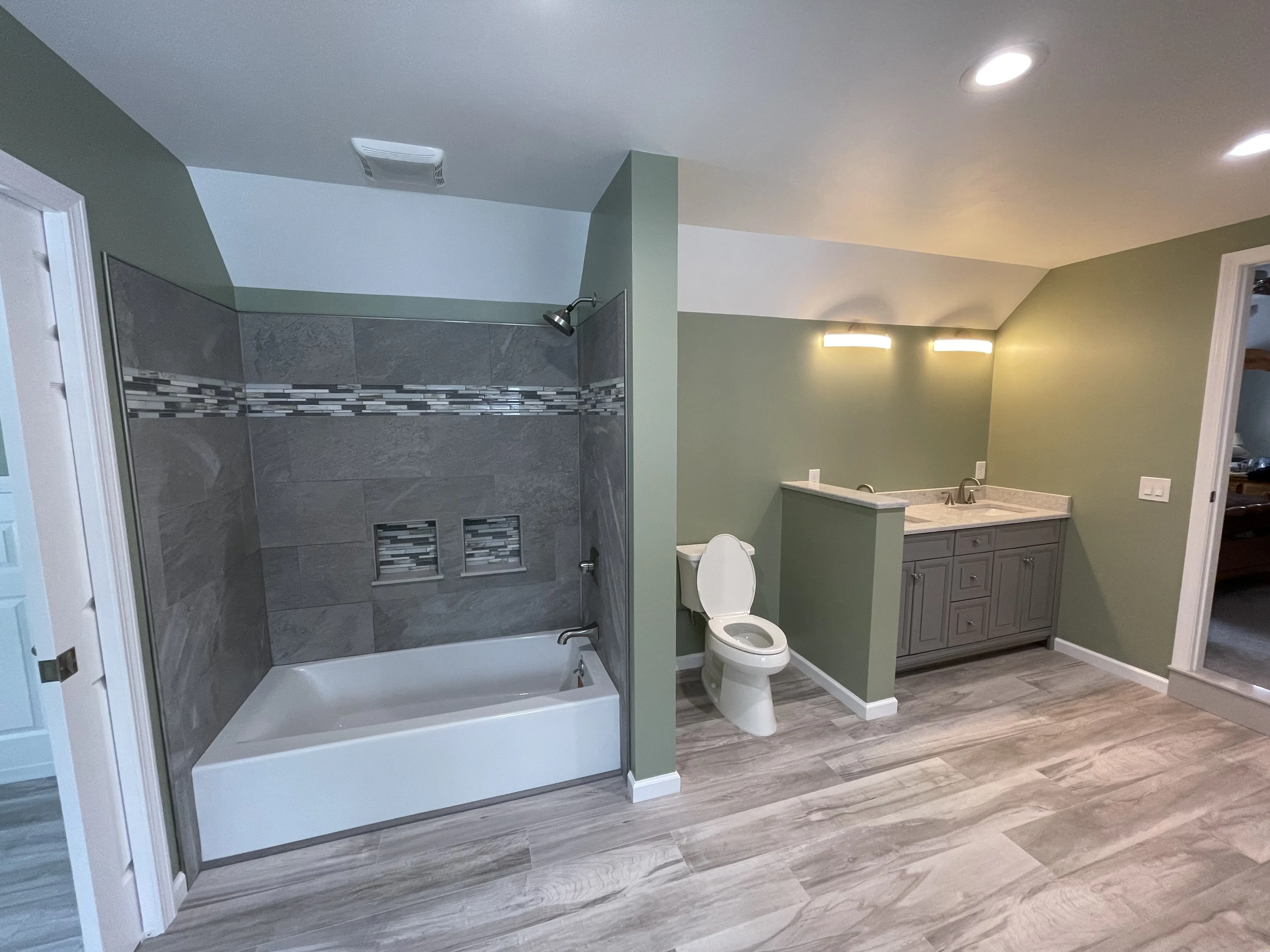 Licensed Bridgeport plumber providing expert plumbing services and repairs in a residential bathroom.