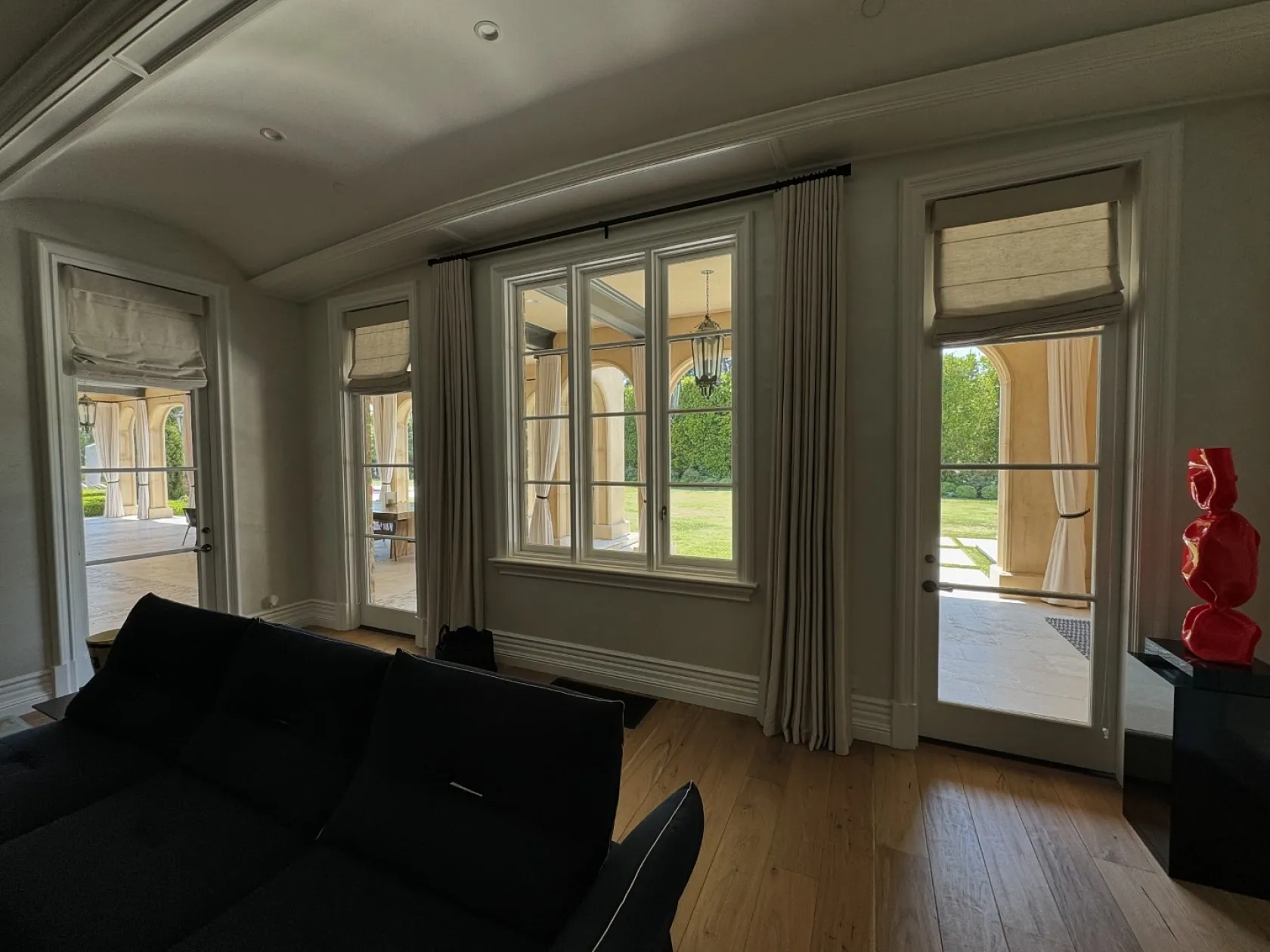 Luxury living room featuring new tint on side windows and rear windows, offering improved fuel efficiency, reduced UV exposure, and privacy—all delivered with professional, quality work by a highly recommended expert team.