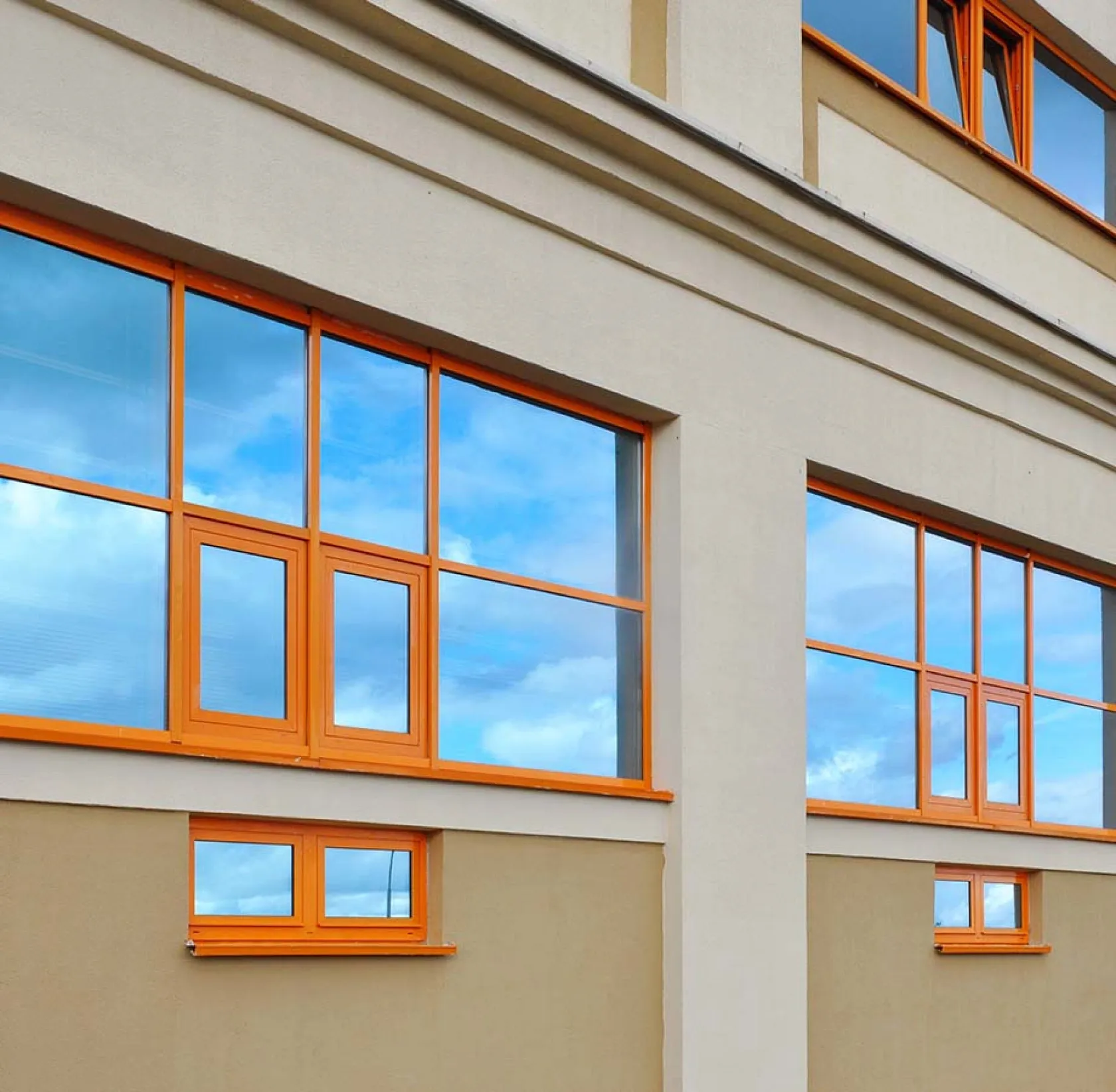 Commercial building with window tint installed on large rear side windows, An amazing job providing reduced glare and block UV rays benefits for vehicle owners seeking legal tint options for car window tinting and their front windshield.