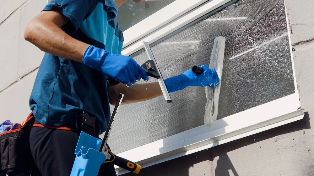 Professional window cleaner providing washing services for residential property in North Vancouver.