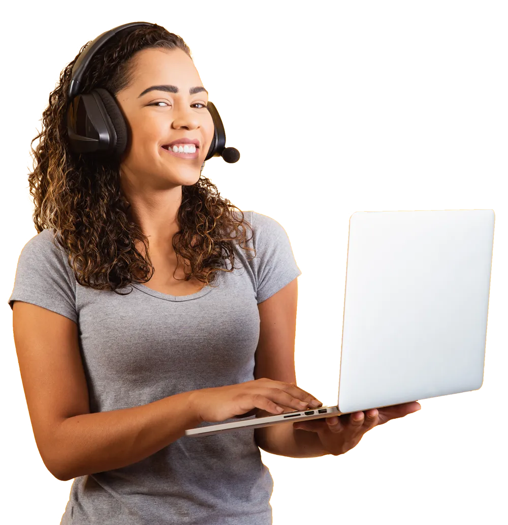 A business professional using a VoIP system while holding their laptop.