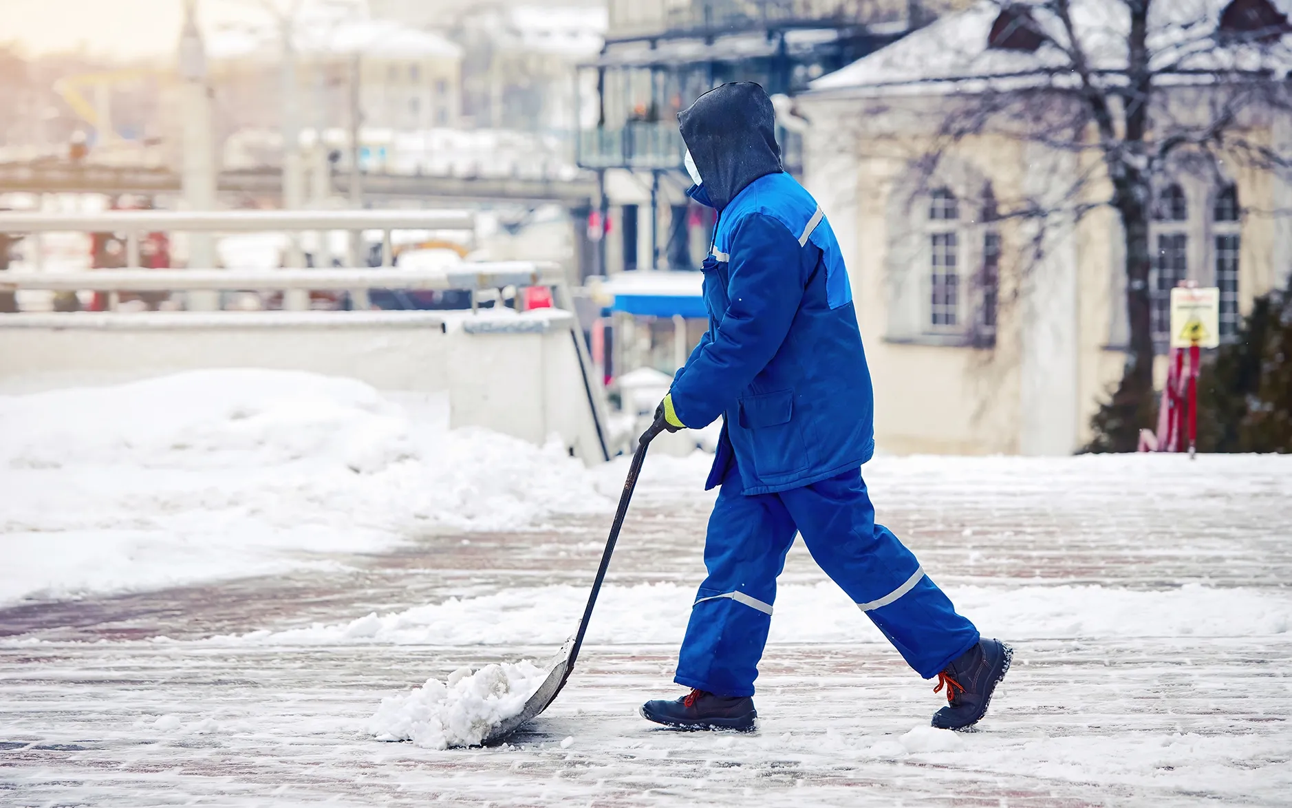 Professional snow removal crew at a commercial property parking lot in the Chicagoland area