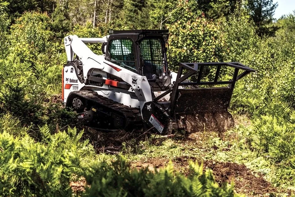 Forestry mulching machine on a job site producing nutrient rich mulch as part of texas land clearing operations with forestry mulchers.