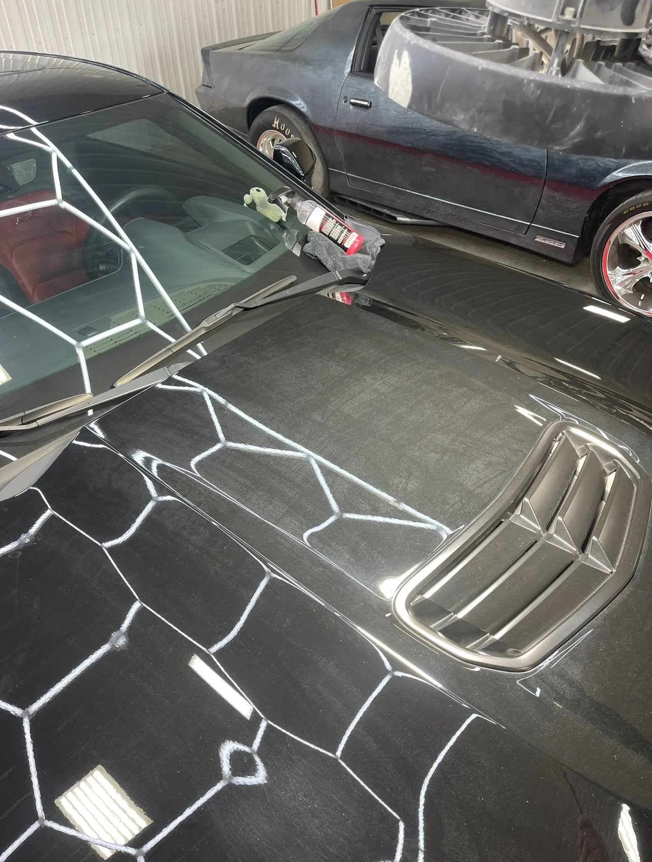 A black vehicle before receiving a ceramic coating. 