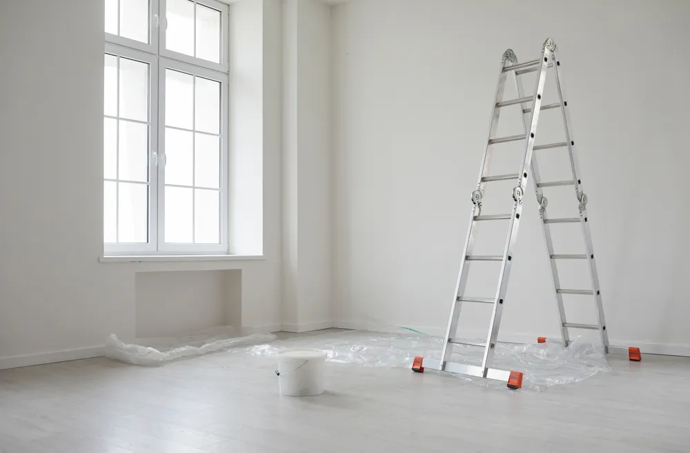Friendly painting crew finishing a residential interior project with clean results