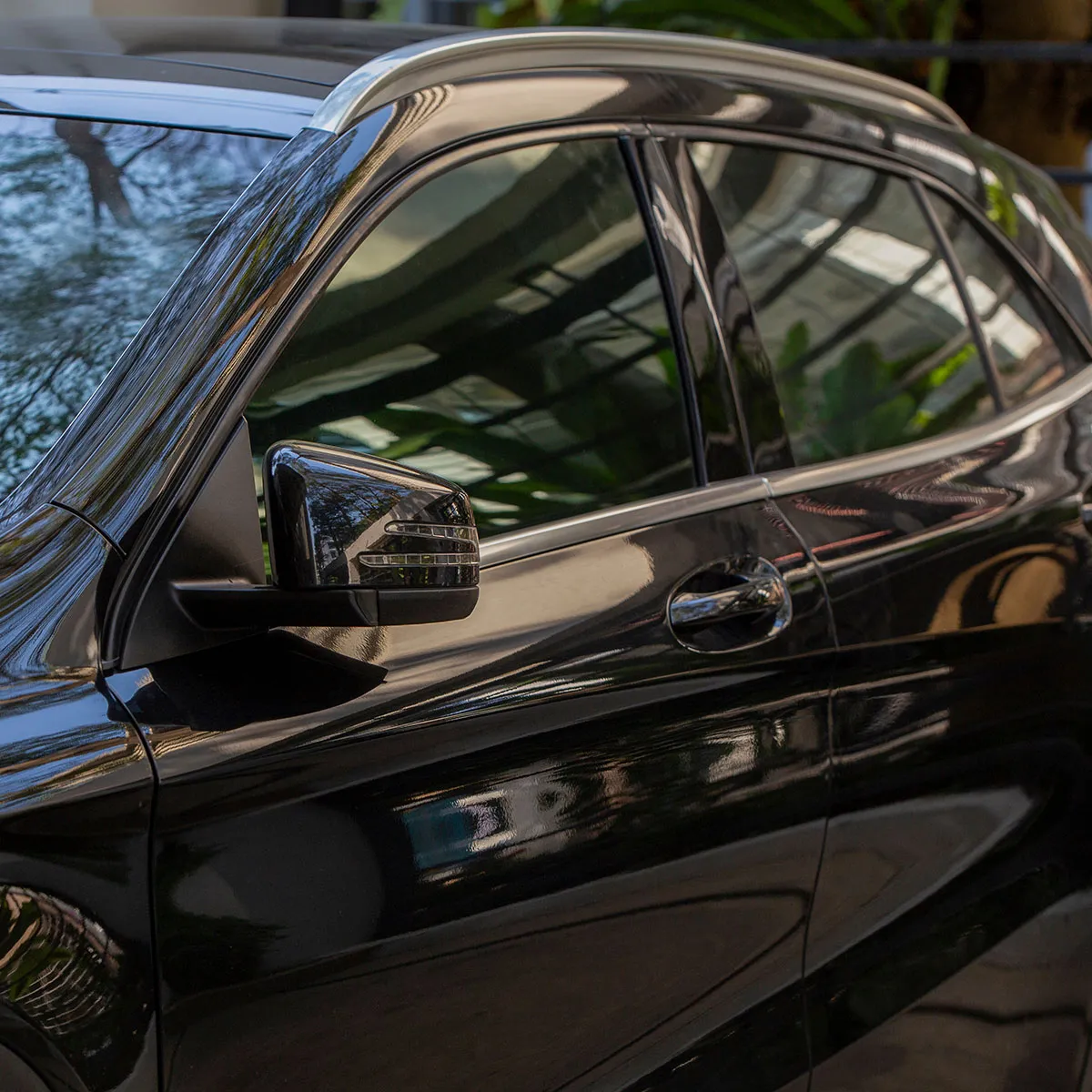 A black car with its windows tinted.
