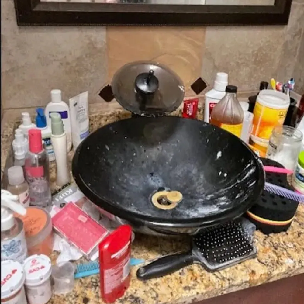 Deep house cleaning service professional scrubbing a bathroom in Philadelphia with Brazilian cleaning techniques