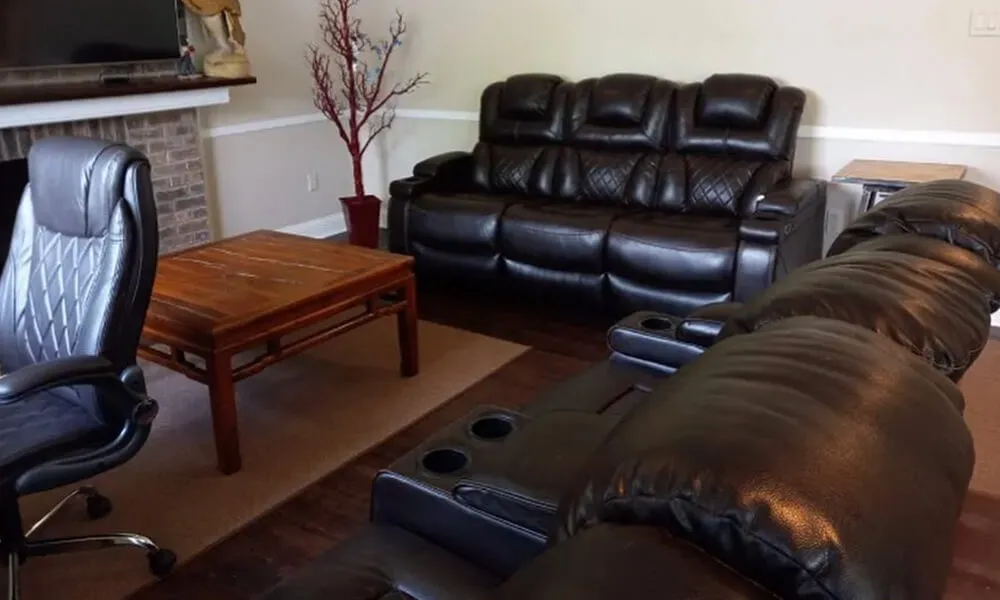 Professional cleaner mopping hardwood floor during move-out service in Philadelphia