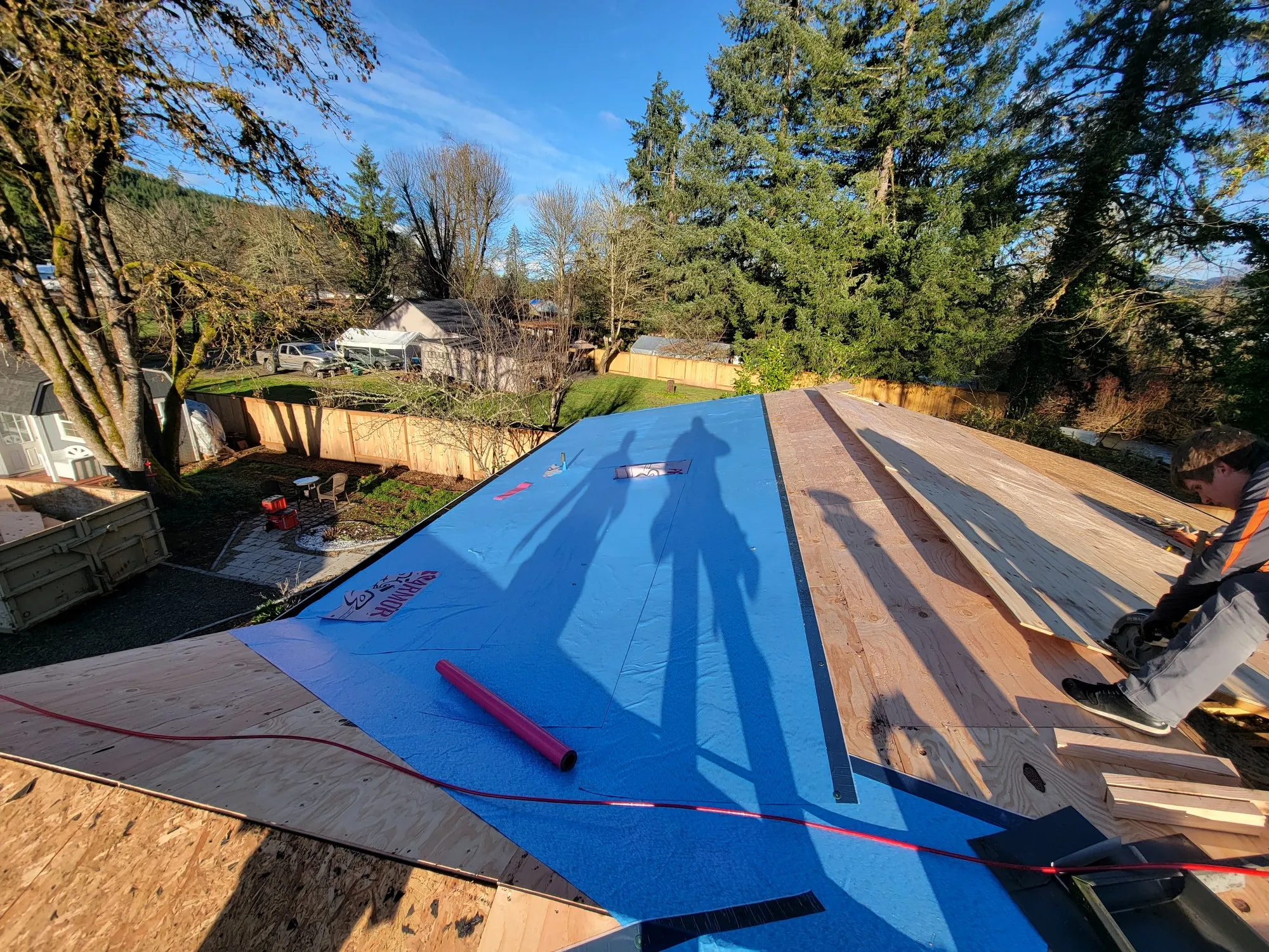 Expert Roof Medics LLC professionals meticulously installing a durable, stylish roof on a residential property in Creswell, Oregon.