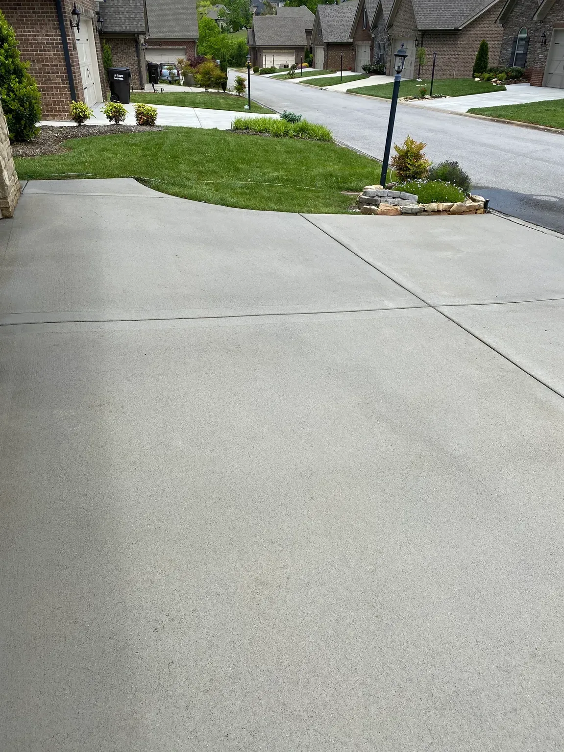 A clean concrete patio space, perfect for outdoor entertaining after our cleaning service.