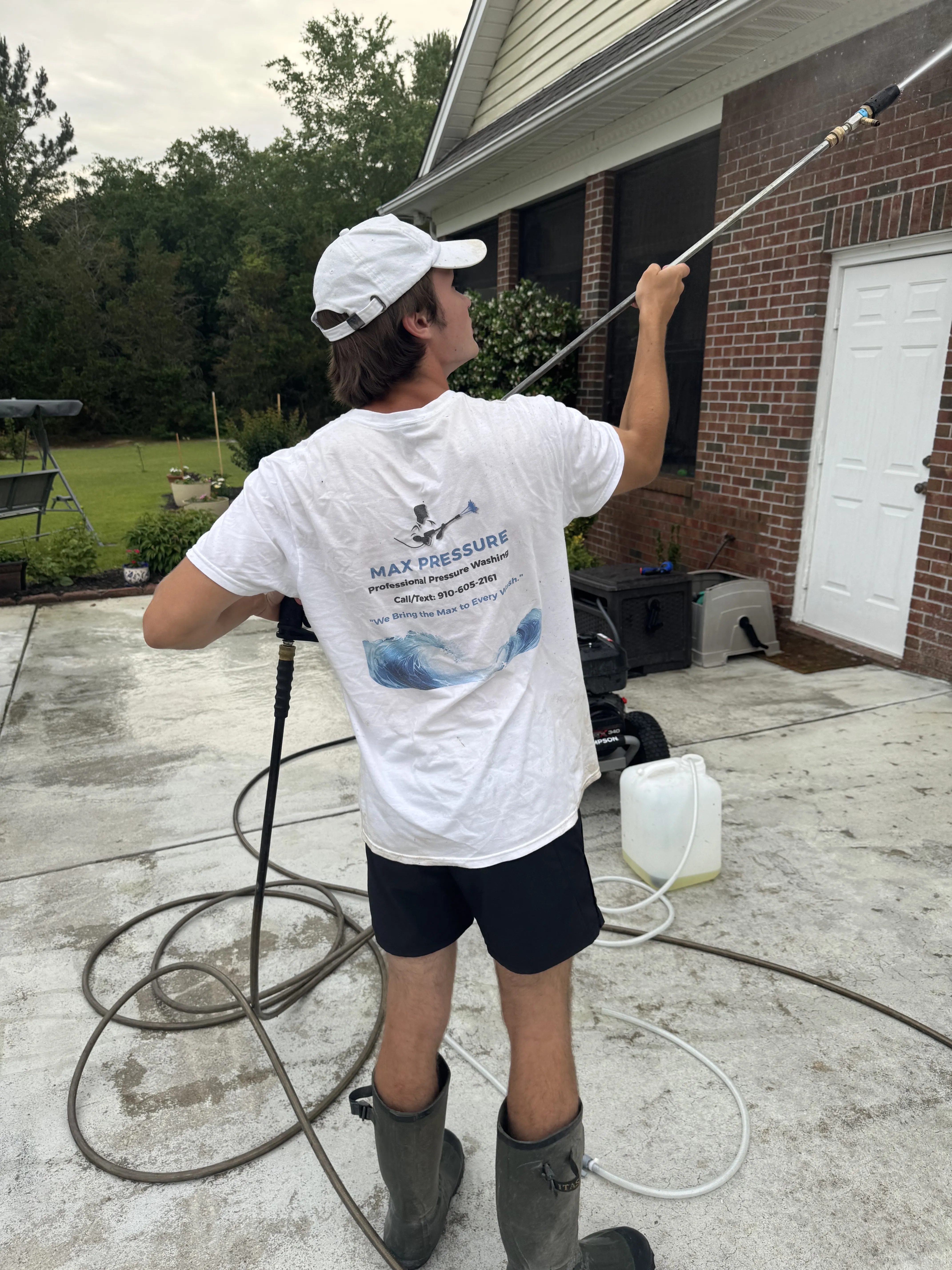 Max Pressure technician providing house washing services in Fayetteville, NC.
