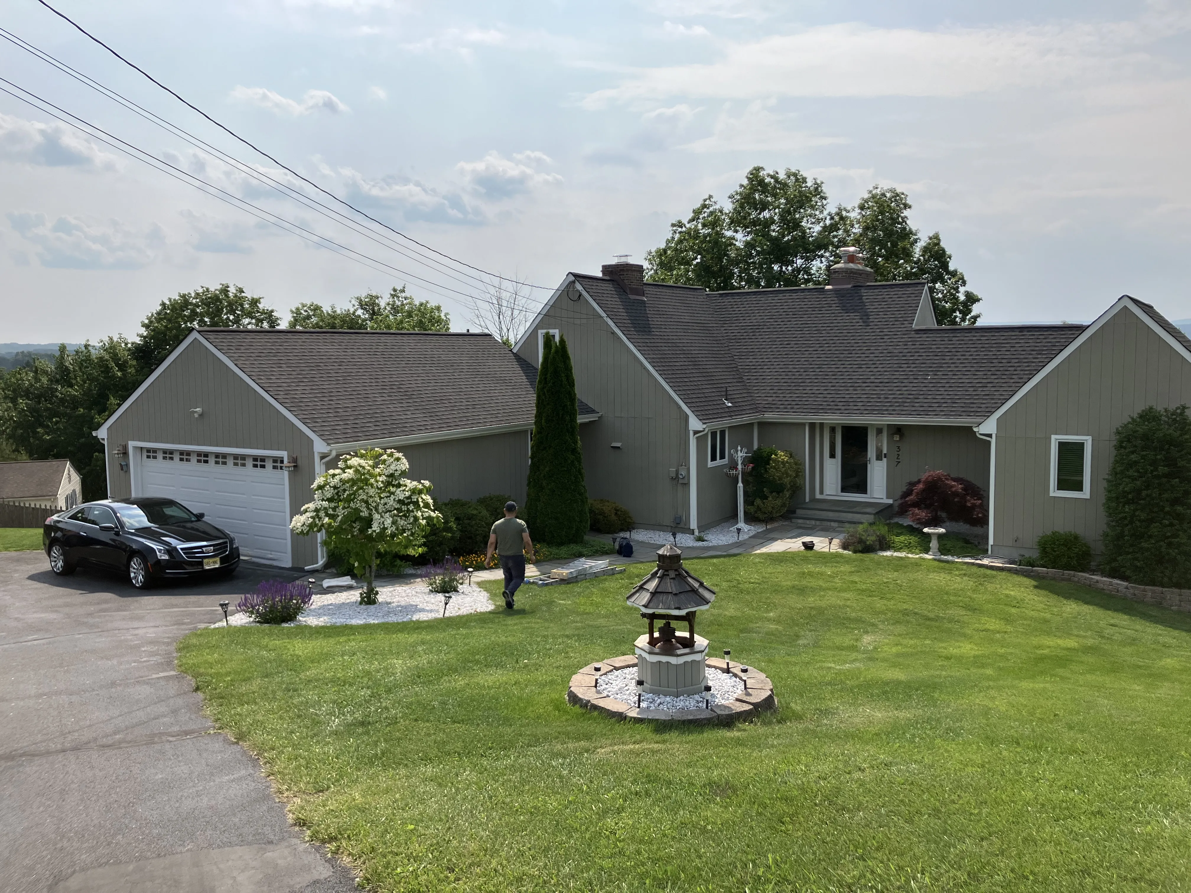 Professional painters completing exterior house painting services with top quality paints and attention to detail for superior service.